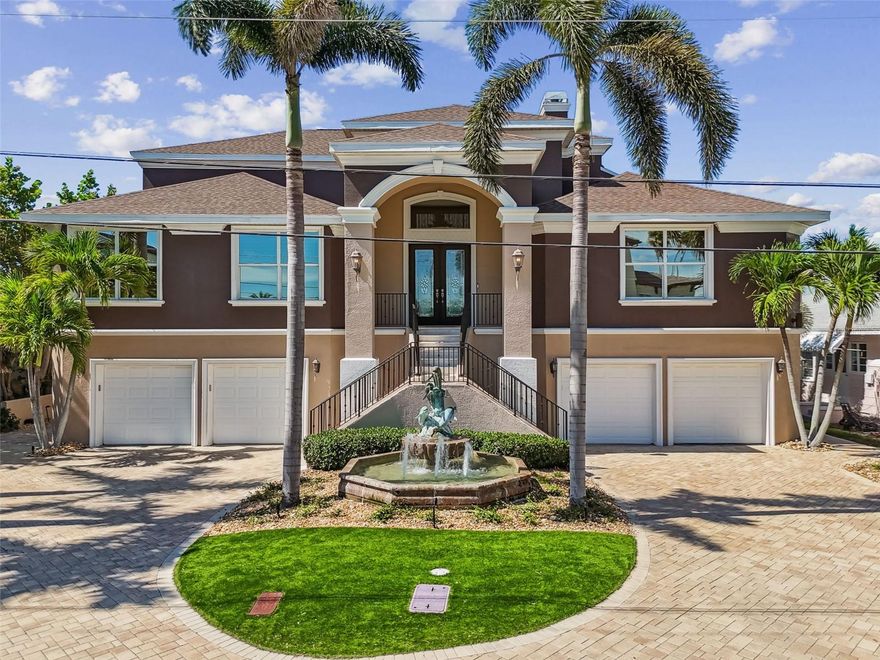 Welcome to 162 Devon Drive, a spectacular waterfront estate offering unparalleled elegance, comfort, sweeping views of the Intracoastal and Clearwater Beach Marina! This 5-bedroom, 4-bathroom residence is positioned on a rare 80-foot-wide lot in the heart of Clearwater Beach, combining timeless architectural charm with modern luxury.
Inside, the home features soaring ceilings and a bright, open-concept floor plan ideal for upscale living and effortless entertaining. The gourmet kitchen has been recently updated and includes a Miele built-in coffee system, Sub-Zero refrigerator, Wolf gas stove, Café double oven, and a spacious walk-in pantry. Adjacent to the kitchen, an impressive custom-built 128-bottle wine rack adds both function and sophistication to the entertaining space. The expansive family room includes a grand fireplace, wet bar, and remote-controlled electric blinds.
The owner’s suite offers a serene private retreat with panoramic water views, a fireplace, and dual custom walk-in closets. The spa-style master bath features a steamer, lighted air jet tub, bidet toilet, and a large rain shower with dual controls. Each bedroom offers water views and custom-lit closets.A full-size three-stop elevator (installed in 2019) provides easy access to all levels. Outdoor living is equally impressive with expansive lanais overlooking the water. The first floor features a custom-designed man cave with a bar crafted from water-resistant composite materials, a full bathroom, and epoxy flooring throughout. The resort-style backyard is designed for ultimate relaxation and privacy, featuring a 38-foot saltwater pool and spa, synthetic turf putting green, lush tropical landscaping, and a dedicated pool bathroom.
The updated seawall and dock (completed in 2019) feature two boat lifts. There are five oversized garages, including one air-conditioned garage equipped with a deep freezer, refrigerator, and additional washer and dryer. PGT reflective hurricane-rated windows, remote-controlled blinds on the main level for added comfort and security. The roof and all four A/C units were replaced in 2019.
Located just steps from Clearwater Beach’s renowned white sand shores, dining, and entertainment, this home offers the best of coastal luxury living!