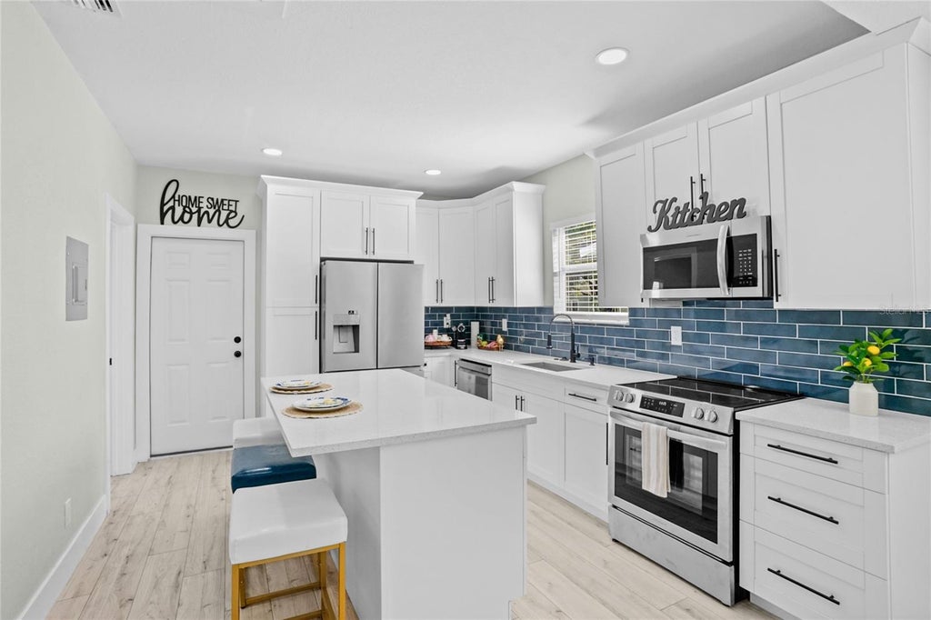 Photo of 2603 W Saint Conrad Street, Tampa, FL 33607 (MLS # TB8544777)