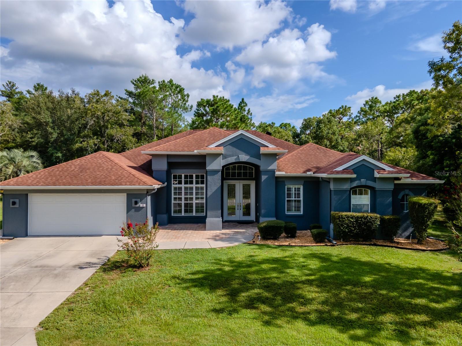 Welcome to this truly exceptional, fully updated home situated on a spacious .27-acre lot with no rear neighbors ever, offering rare privacy and tranquility. This turn-key property features 3,249 square feet of beautifully updated living space, including 5 bedrooms, 3 bathrooms, and a 2-car garage. One of the bedrooms is ideally positioned to serve as a den or office, complete with a closet, making it a versatile space to suit your needs.
The home is equipped with major system upgrades, including a roof (2015), energy-efficient 4-zone A/C (2021), and a hot water heater (2022). From the moment you arrive, you'll notice the striking curb appeal and luxury feel. Entering through double doors into the foyer, you're welcomed by expansive views of the pool through triple-pane sliding glass doors that fully stack into the wall, blending indoor and outdoor living effortlessly.
To the left, the formal dining area overlooks the front yard and features an elegant quartz-topped knee wall. The spacious master suite is located nearby and offers a trey ceiling, dual closets, and a sliding glass door to the pool. The ensuite bathroom is complete with ceramic tile flooring, a dual sink wooden vanity, a garden tub, a private commode closet, and a walk-in tiled shower with body jets.
The open-concept kitchen and family room are perfect for entertaining. The eat-in kitchen boasts wood cabinetry, a center island with deep drawers, quartz countertops, a stylish tile backsplash, pot filler, glass cooktop, wall-mounted oven and microwave, stainless steel appliances, a vented cooktop hood, under-cabinet lighting, and a spacious breakfast bar. The adjacent laundry room includes a deep sink, wire shelving, extra cabinets, closet space, and a countertop for folding.
The family room features a double tray ceiling and another set of triple-pane sliding glass doors that open to the pool area. A hallway with a pocket door provides privacy for two guest bedrooms, both with Berber carpet, ceiling fans, and large closets. Between them is a guest bathroom with a tub/shower combo and single sink vanity. A third guest bedroom is located nearby with its own sliding glass door to the pool, and is adjacent to a third bathroom that also has a pool entrance, tub/shower combo with tile surround, single sink vanity, and storage closet. The fifth bedroom is located just off the master suite and can function as an ideal office or den while still offering full bedroom functionality with a closet.
Step outside to your private oasis featuring a large in-ground saltwater pool, paver pool deck, and a newly screened lanai—perfect for relaxing or entertaining. Additional upgrades throughout the home include plantation shutters, luxury vinyl plank flooring, upgraded ceiling fans and light fixtures, quartz accents, updated exterior paint, and more. The property also comes equipped with two whole-home GENERAC generator plugs, security system, gutters, and irrigation system.
This immaculate home offers a perfect blend of luxury, comfort, and peace of mind. With no rear neighbors and every detail thoughtfully updated, this home is ready for its new owners. Don’t miss your chance to make it yours today!