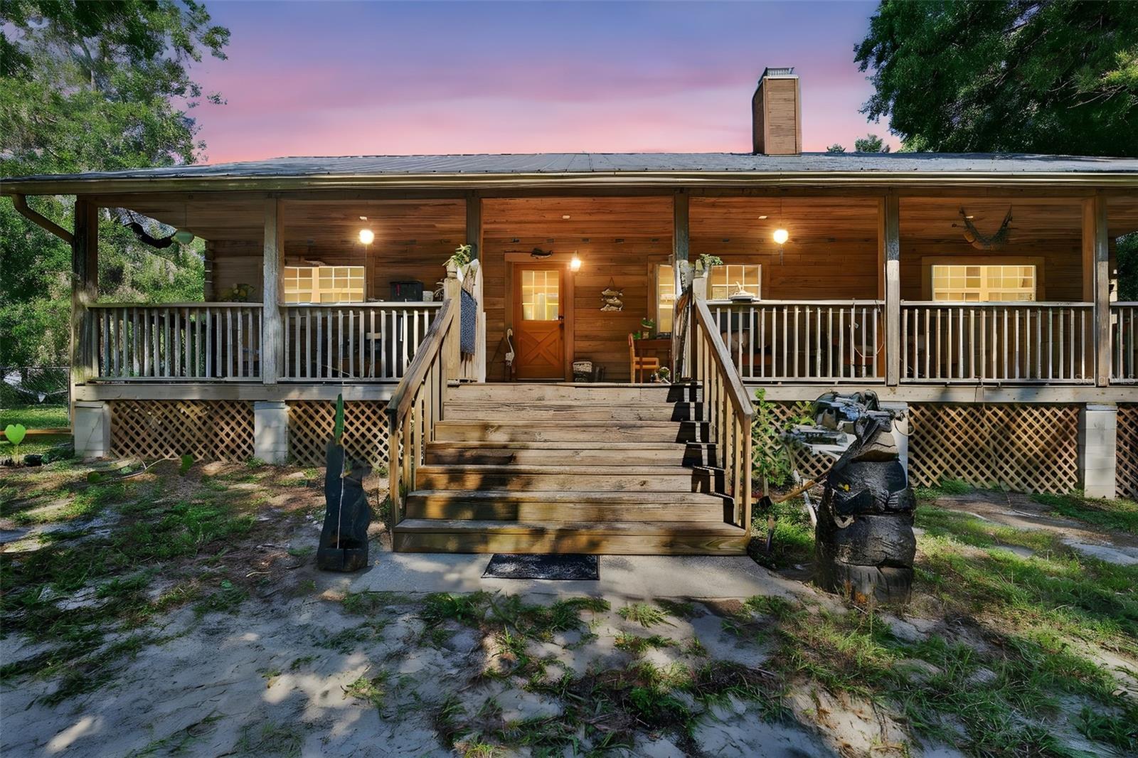 Rustic 3-Bed, 2-Bath Log Cabin on 2.88 Private Acres in the desired Golden Acres Neighborhood!
Welcome to your dream retreat—this charming 3-bedroom, 2-bath log cabin sits on 2.88 private, wooded acres in a golf cart-friendly neighborhood, offering the perfect balance of rustic living and modern convenience.
Step inside and feel right at home with warm wood cabin walls, wood floors, and a cozy brick fireplace at the heart of the living space. The spacious kitchen is thoughtfully positioned at the center of the home, ideal for gathering with family and friends. A generous primary suite features a large en-suite bathroom for added comfort, while two additional bedrooms and a second full bath provide plenty of space for guests or family. Enjoy peaceful mornings or relaxing evenings on the expansive country-style front deck, surrounded by the sights and sounds of nature including deer that frequent the area! Grill and chill on the expansive back deck- perfect for summer barbecues, quiet evenings under the stars, or simply soaking in the beauty of your private surroundings. Home features two versatile outbuildings - one with old rustic charm and the other offers a classic country barn style look - both offering room for storage, hobbies, or workshop space. Love animals? This property welcomes your chickens, goats, and more—perfect for those seeking a hobby farm or sustainable lifestyle. And while you’ll feel worlds away, you’re just minutes from town amenities such as shopping, schools, parks, and dining. If you’re ready to enjoy true country living with space to roam, a welcoming community, and the comfort of a well-built log cabin, this is the one you’ve been waiting for. Schedule your private showing today and come experience the charm of this unique country escape! **Property lines on photos are approx.