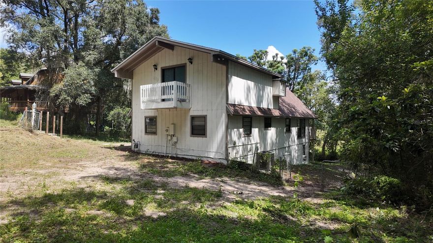Seller Says Sell It - Love it but short on Down Payment? RENT TO OWN is AVAILABLE - USDA ZONE.  COME NOW AND DISCOVER THIS GEM! Step into this stunning Ranch-style residence in the heart of Fruitland Park, Florida — fully renovated and truly move-in ready! This 3-bedroom, 2-bath home with approximately 1,632 sq ft blends the charm of original restored wood details with modern, high-end finishes to create a warm, elegant, and functional space. The home features a brand-new roof, a fully updated kitchen with new cabinets, countertops, and appliances, all-new flooring throughout, and fresh neutral-tone paint that brings brightness and a modern feel. Upon entering, you're welcomed by a spacious living room flooded with natural light from large windows. Restored wood accents highlight the home’s classic ranch character, offering both authenticity and comfort. Two outdoor decks are true highlights: One, just off the main living area, perfect for BBQs, family gatherings, or enjoying Florida’s sunshine. The second, directly off the primary bedroom, offers a private space to enjoy your morning coffee, peaceful reading time, or beautiful sunsets surrounded by nature. And there’s more — a fully renovated basement provides flexible space for a guest bedroom, home office, meeting room, or entertainment area. This extra living area adds functionality and is perfect for today’s lifestyle needs. The oversized lot is shaded by mature trees, offering privacy and a tranquil setting with views of the lake and surrounding greenery — your very own backyard oasis. Location is key: Just minutes from US-441 and US-27, you're close to Leesburg, The Villages, and Orlando. Outdoor lovers will appreciate nearby Lake Griffin State Park with access to kayaking, fishing, and hiking. Essential services, grocery stores, restaurants, and schools are all within easy reach. This move-in-ready home offers unbeatable value in Florida’s dynamic real estate market. Its blend of renovated charm, modern upgrades, versatile layout, outdoor living, and prime location makes it the perfect choice for buyers seeking a turnkey home surrounded by nature yet close to everything.