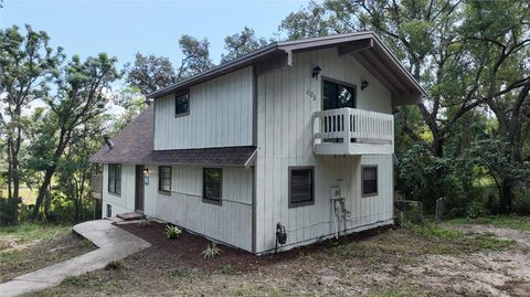 Photo of 409 S Dixie Avenue, Fruitland Park, FL 34731 (MLS # O6406459)