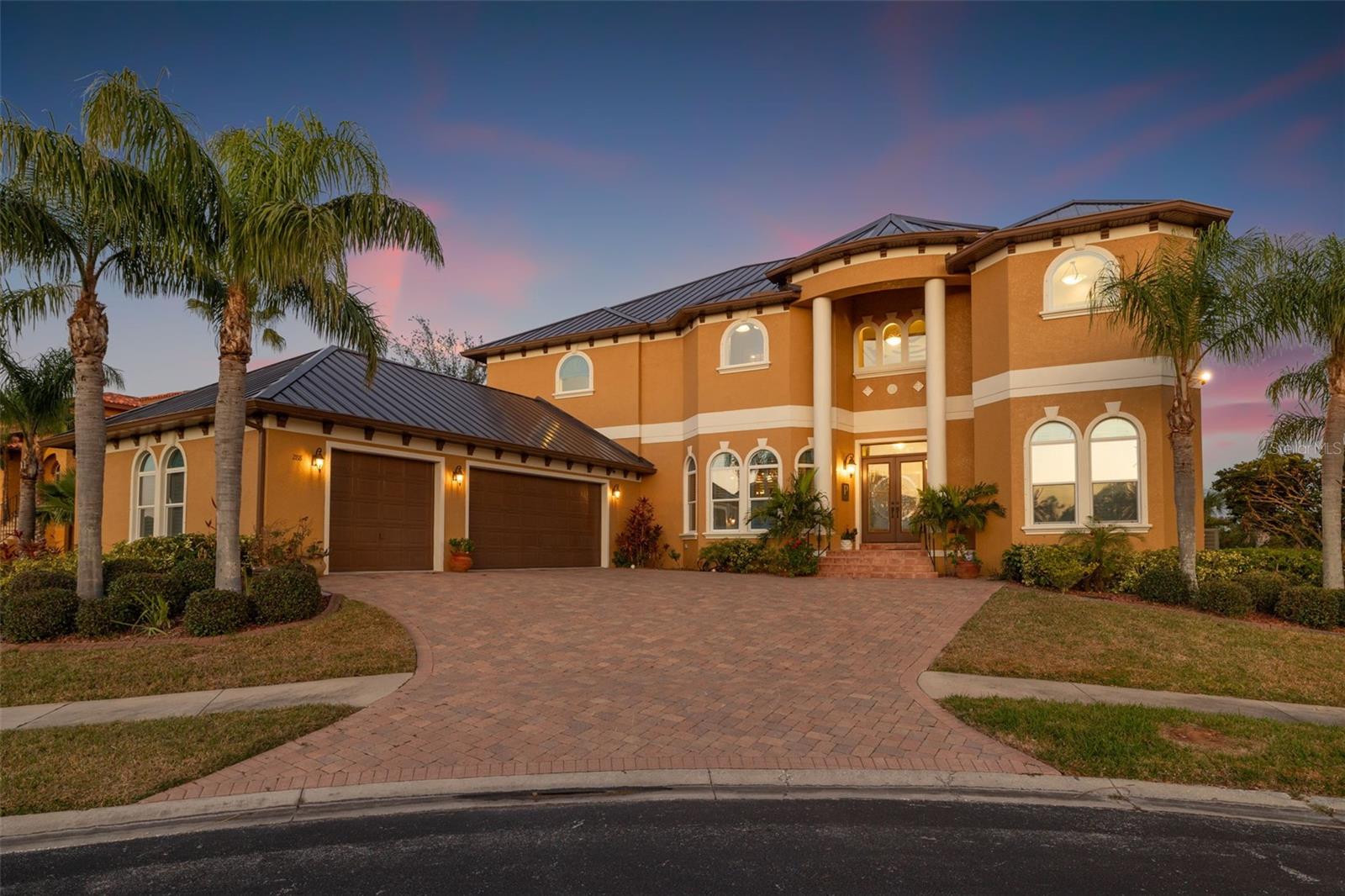 Luxury living with an abundance of privacy, amazing views, an open floor plan, and ample closet space are just a start. This cul-de-sac custom-built home of unparalleled elegance within a gated enclave features breathtaking water views and gleaming natural light without compromising privacy. Spanning 5,260 square feet, this 2 story meticulously designed residence features 4 bedrooms, study, game room, retreat room, 6 bathrooms, an elevator and an extended 3-car garage. Step inside to soaring ceilings, coffered detailing, and expansive windows with abundant light as well as privacy. This gourmet kitchen is a chef’s dream, outfitted with a top of the line Wolf range, stainless steel appliances, built-in ovens, microwave, beverage fridge, and generous walk-in pantry with attached second refrigerator. The open-concept kitchen, family room, breakfast nook, and transitional area provide a seamless flow for both everyday living and entertaining with direct access to covered patio. The main level also hosts spacious living room, bedroom with a full bath, and game area. Hardwood stairs, elevator and exterior spiral staircase connect to the second floor. The primary suite is a private sanctuary featuring an opulent ensuite bath, a custom walk-in closet with an organizing system, and breathtaking, unobstructed bay views with patio access. Large second-floor retreat room offers more opportunities for relaxation and gatherings. Outdoor living is unparalleled with two covered patios and a third-floor crows nest all with panoramic water views of Tampa Bay, and a custom-designed saltwater Pebble-Tec pool & spa to enjoy Florida’s year-round sunshine. The extended garage features larger doors, and built-in closets for maximum storage. Built with both style and security in mind, this home includes hurricane clips, fabric shutters, and remained high & dry during Hurricane Helene & Milton. A brand new high-end aluminum roof (2024) adds lasting durability for years to come. Enjoy your resort-style amenities and a prime central location with less than 30 minutes from St. Pete/Clearwater International Airport, Tampa International Airport and top-rated private and public schools. Within the hidden treasure of Pinellas County, you are close to great shopping, specialty dining, and Florida's beautiful gulf beaches. Discover the pinnacle of Luxury, privacy, and serenity within this unique home that can be yours today.