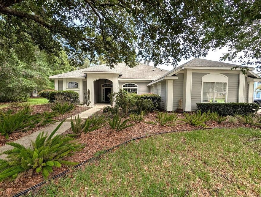 One or more photo(s) has been virtually staged. Welcome to this beautifully updated 4-bedroom, 2-bathroom traditional home in the highly desirable Millhopper/Montclair area of NW Gainesville. Step into the foyer and you're greeted by soaring 9-foot ceilings that carry through a separate formal living and dining area, perfect for entertaining. Continue into the open-concept family room, where those same high ceilings, abundant natural light, and a cozy  fireplace. The updated kitchen features quartz countertops, stainless steel appliances, a gas stove, and a breakfast nook with bar seating. The spacious owner's suite overlook the serene backyard with direct access to the screened porch. The master bath offers dual sinks, a jetted tub, a separate shower, and two walk-in closets. Nice view of the tranquil pond, nature preserve, and adjacent conservation area, where nature and wildlife abound.  Upgrades include a roof and new piping (2020). Located in the well-established Millhopper Station community. You'll enjoy a low HOA fee and A+ rated schools, all within a short distance of Publix, local restaurants, banks, North Florida ER, San Felasco, and Devil's Millhopper State Park.