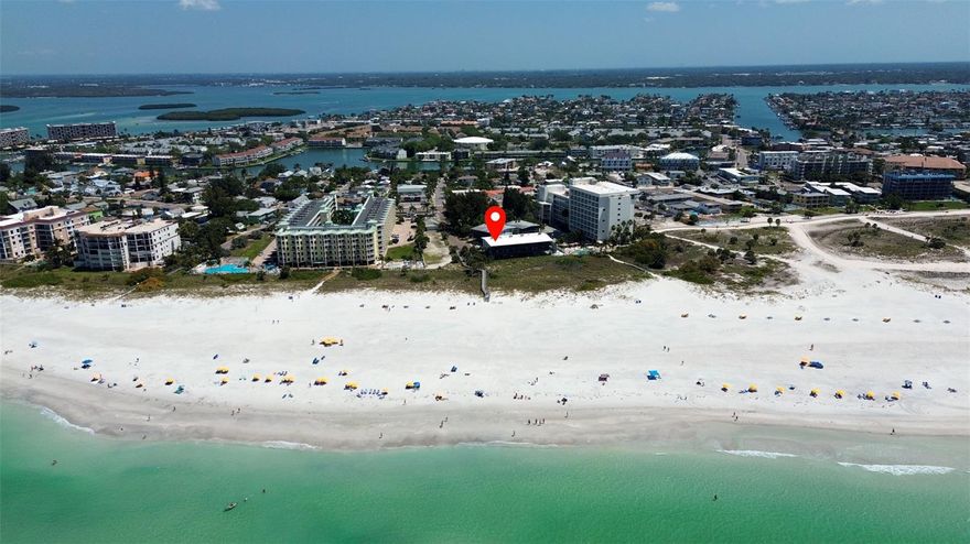 RATES ARE FOR MONTHLY, OFF SEASON $11,000/ SEASONAL IS $13,000. PLUS TAX AND CLEANING FEE. CAN BE LEASED WEEKLY, PLEASE INQUIRE FOR RATES. Welcome to your dream vacation getaway on the sugar sands of Treasure Island Beach! This stunning 2 bedroom, 2 bath corner unit condo offers an unparalleled experience of beachfront living with breathtaking views of the Gulf of Mexico from every angle. As you step inside, you'll be greeted by an open and airy living space filled with natural light, thanks to two sliders leading to the covered balcony overlooking the azure waters. Relax and unwind in the spacious living area or step out onto the balcony to feel the gentle sea breeze and watch the sunset over the horizon. The updated kitchen is a chef's delight, featuring gorgeous countertops, sleek stainless steel appliances, and ample cabinet space. With its open floor plan, the kitchen seamlessly flows into the dining area and living room, making it perfect for entertaining or simply enjoying a cozy meal with loved ones. Both bedrooms are thoughtfully designed for comfort and relaxation, with plush bedding and ample storage space. The master bedroom boasts its own ensuite bath, while the guest bedroom is conveniently located near the second updated bathroom. When you're not soaking up the sun on the beach, take a refreshing dip in the community pool or lounge on the pool deck with a good book. With inside laundry facilities, you can pack light and enjoy a stress-free stay. 2 UNDER BUILDING PARKING SPACES!! Located in close proximity to shopping, restaurants, and the vibrant Johns Pass Village, you'll have easy access to all the attractions and activities that Treasure Island has to offer. Whether you're seeking adventure or relaxation, this condo has everything you need to make your vacation a truly unforgettable experience. Book your stay now and get ready to create lifelong memories in paradise!