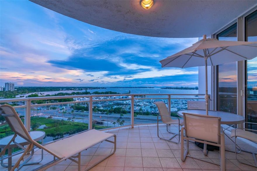 Eye-popping panoramic views of the marina, Sarasota Bay, the Keys and Gulf dominate this 10th-story, open-space contemporary condominium extensively remodeled in late 2017. Three sliding-door terraces surround a den and two of the three bedrooms, each overlooking the walking-distance downtown venues of parks, shops, restaurants and entertainment. Marina Tower is Sarasota’s most desirable location and most envied for its management and personal services by a highly skilled executive manager and 24-hour front-desk personnel. In pristine condition, this well-loved, spacious, single-floor, 2,900-square-foot home was refashioned by one of Sarasota’s most meticulous and skilled contractors. High-end, up-to-date materials, fixtures and plumbing/electrical appliances were selected for appearance and function. The chef’s dream kitchen wraps around a massive, quartz-countertop island, ideal for hosting large groups or sitting down to breakfast for a few. Open to the vista views, the kitchen is equipped with stainless steel, double-door refrigerator/freezer, double wall ovens and Thermador induction cooktop. Cabinetry includes floor-to-ceiling pantries, glide-out shelving and hinged lift-up doors in the overheads. Both the large living space and master bedroom are open to the bayfront patio. All three bedrooms have their own en-suite full bath and walk-in closets. The master bedroom accesses a dressing room with a built-in closet. The master bath includes both a double sink and a sit-down make-up vanity. A glass-enclosed, benched walk-in shower, private water closet and linen storage complete the mirrored space. The master and a guest bedroom offer additional wall closets. Linen/utility closets stretch along an entire hallway. An en-suite walk-in storage pantry accommodates a wine cooler in one corner. A deep-shelved, floor-to-ceiling off-kitchen pantry was customized to house oversized serving pieces. The remote-controlled blinds throughout the condominium, black-out blinds and exquisite draperies in the master bedroom simplify privacy and light control. The living room includes an entertainment center with custom-built shelving and cabinetry. The walk-in utility/laundry room displays up-to-date, high-capacity appliances. The other three units on the 10th floor were combined into a single unit by the current owners, who arrive on an elevator that opens directly into that condominium, rendering 1004 among the most private spaces in the building. Front desk personnel will assist with unloading residents’ cars in the private, lobby-attached above-ground-level, monitored garage. Two deeded parking spaces are included. Owners’ guests may stay in a private suite adjacent to the lobby. The main floor includes an entertainment space, a pool, hot tub and a fully equipped gym. This uniquely situated, spacious, luxurious downtown condominium is a rare turnkey find. Room Feature: Linen Closet In Bath (Primary Bedroom).
