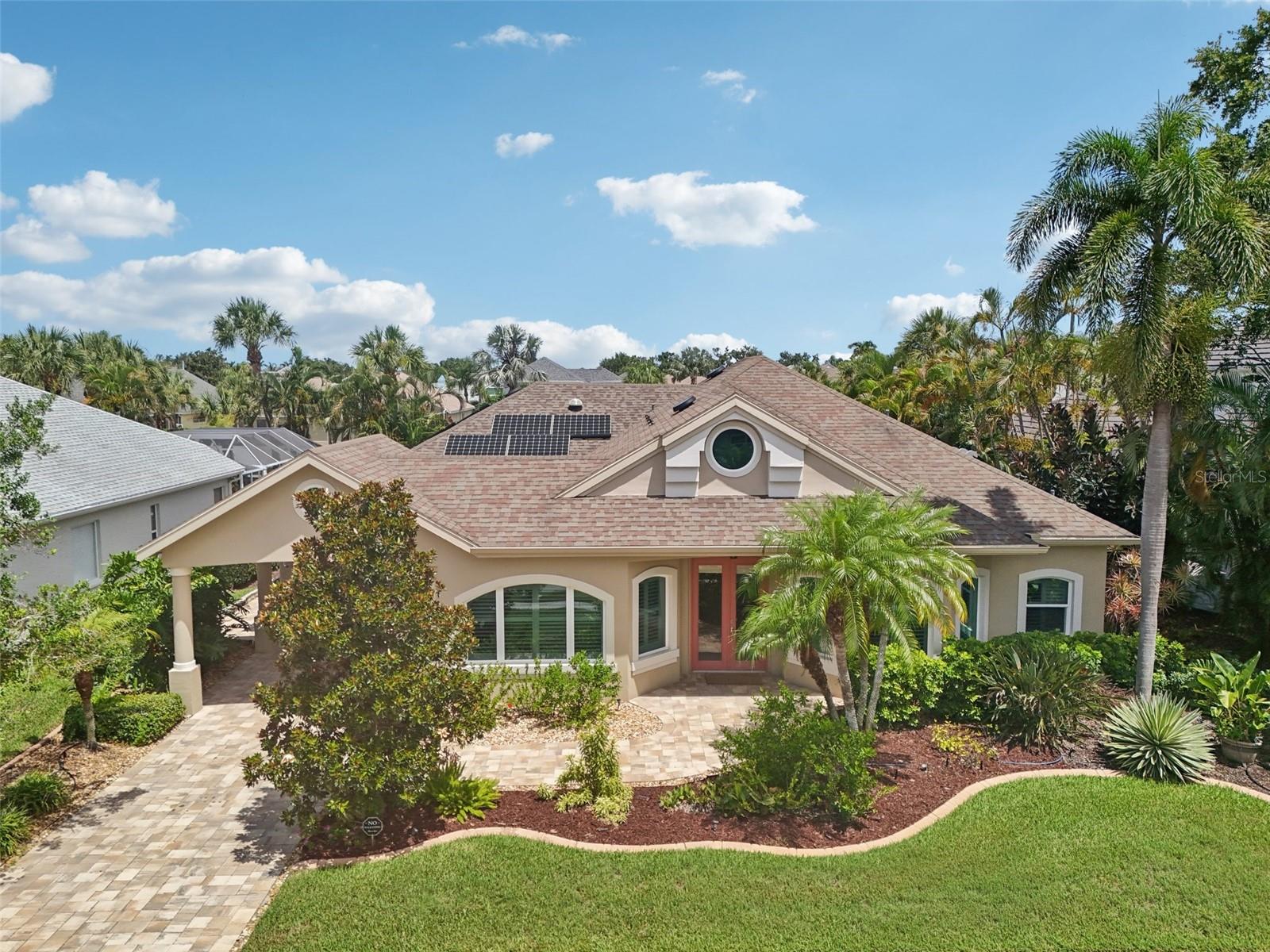 Discover exceptional craftsmanship and refined upgrades in this stunning waterfront residence, located on a quiet cul-de-sac in the exclusive boating community of The Inlets at Riverdale. This beautiful home showcases recent high-end updates that elevate both lifestyle and value. Enjoy peace of mind with new hurricane impact windows, a whole-house solar energy system with a transferable warranty, and a high-efficiency Trane 22 SEER HVAC system. The home’s curb appeal is enhanced by a new paver driveway and an extended three-car tandem garage, offering versatile space for storage, hobbies, or golf cart. Outdoor living is a dream, featuring a private pool and spa, new “open view” pool enclosure, upgraded porcelain tile decking, new heater, and a fully equipped outdoor kitchen with built-in grill, refrigerator, and cabinetry. The 50-foot dock with covered lift, new pilings, floating jet ski provide direct access by the Manatee River, to Anna Maria, the Sunshine Bridge, Tampa Bay, and the Gulf of Mexico. Your convenient water access to local restaurants, shopping, sand bars and favorite fishing spots. Inside, the home offers an airy, light-filled layout with elegant finishes throughout. Highlights include custom maple cabinetry, Taj Mahal quartz countertops, plantation shutters, crown molding, and designer tile and hardwood flooring. Entertain effortlessly with the newly added entertainment bar featuring cherry cabinetry, wine cooler, beverage center, and quartz surfaces. The gourmet kitchen boasts stainless steel appliances, wall ovens, warming drawer, cooktop, and a large breakfast bar. A spacious walk-in pantry and additional office/craft room with built-in cabinetry for flexibility and function. With 3–4 bedrooms and 3 full baths, including a secondary suite ideal for guests or multi-generational living, the layout provides space and privacy. The office features wood-look tile and an upgraded bath. California closets and thoughtful built-ins complete the home’s meticulous design. Additional features include new porcelain tile in guest rooms, upgraded bathrooms, whole-house water filtration, solar attic fans, and attic storage with pull-down access. All of this is just minutes from I-75, downtown Bradenton, Anna Maria Island, and world-class beaches, shopping, and dining. Enjoy sunsets from your private dock and make every day a waterfront escape. Schedule your private showing today—this home truly stands apart.