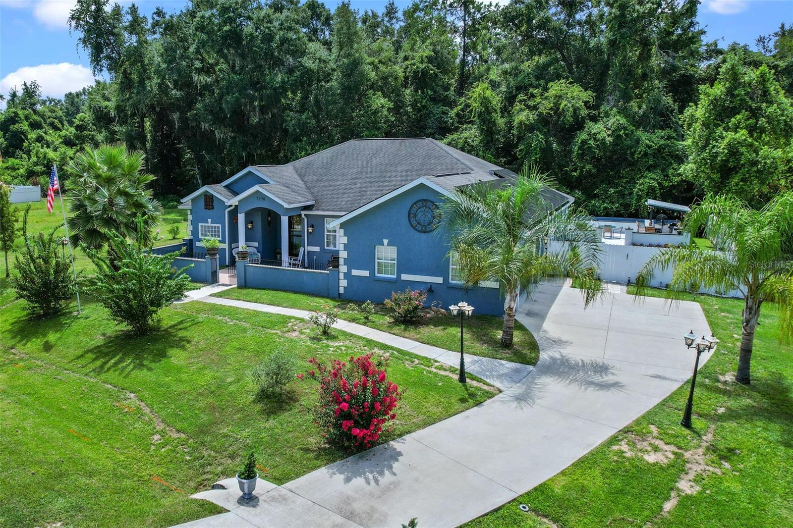 Welcome to Hidden Lakes- Spacious and Move-In-Ready Home! Located in the desirable Hidden Lakes subdivision, this beautifully appointed 3-bedroom, 2-bath home, built in 2019, offers 2,342 square feet of well-designed living space with a low HOA and numerous features to love. As you approach, you're welcomed by a charming courtyard entrance that sets the tone for the warm and inviting atmosphere inside. Step through the front door to find a formal dining room with elegant coffered ceilings, flowing seamlessly into the open-concept living area. The spacious kitchen features granite countertops, a breakfast bar, a built-in coffee bar, and overlooks the living room with an electric fireplace, creating a perfect space for everyday living and entertaining. Just off the living area is a versatile bonus room currently used as a pool room, ideal as a game room, second living space, or media room. The split floor plan offers privacy and functionality, with the primary suite tucked away on one side of the home. It features a tray ceiling, two walk-in closets with wall safes, an attached office or flex space, and a luxurious ensuite bathroom complete with a soaking tub, separate shower, and double vanity. Two additional bedrooms and a full bathroom are located on the opposite side of the home. Additional features include a 2-car garage, an indoor laundry room, and energy-efficient solar panels that help reduce utility costs. The solar system is leased and fully assumable, offering long-term savings for the new owner. Step into the backyard oasis, where you'll find a 10x16 shed and a custom outdoor bar area with electricity and water, perfect for entertaining or relaxing in your private retreat. Don't miss your opportunity to own this beautifully maintained, versatile, and energy-efficient home in one of Ocala's most sought-after communities!