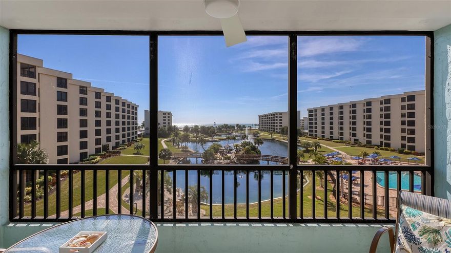 Welcome home to Gulf & Bay Club, the premier condominium community on Siesta Key Beach. Enjoy stunning views of the freshwater lake, fountains, island lagoon, swimming pools, sandy beach, and the Gulf of America from your private lanai. Step into this beautifully remodeled Turnkey Furnished, 2-bedroom, 2-bath beach condo offering modern finishes and thoughtful upgrades throughout. The kitchen is a true standout with quartz countertops and tile backsplash, solid wood soft-close cabinets with pull-out drawers, GE stainless steel appliances, a built-in desk, and a spacious island with ample storage. Enjoy the durable tile flooring throughout, plantation shutters, solid core doors, and recessed lighting that enhances the home’s clean, contemporary style. A new impact-rated entry door adds peace of mind. The private laundry room features full-size LG washer and dryer along with plenty of built-in storage cabinets. In addition to the amazing views, the primary suite also offers a well-appointed bathroom with dual sinks, generous built-in storage, and a walk-in shower. The guest bedroom has two full-size beds and includes built-in drawers for added convenience. Relax on the screened-in lanai and enjoy your morning coffee or evening cocktails.  Gulf & Bay Club spans 32 acres with 800 feet of private beach and offers unmatched amenities, including three heated pools, indoor spa, dry saunas, tennis, pickleball, shuffleboard, billiards, a commercial-grade fitness center, BBQ and picnic areas, electric car charging stations, a car wash area, two clubhouses, a rentable guest suite, and 24-hour gated security. Wi-Fi is available throughout the property.  Located adjacent to the world-famous Siesta Key Beach, ranked #1 in the U.S. by TripAdvisor for its powdery white quartz sand. This property offers a rare opportunity to enjoy resort-style living in one of Florida’s most coveted coastal communities.