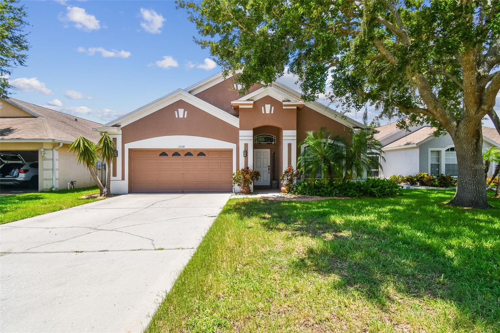 Welcome to this beautifully updated 4-bedroom, 2-bathroom home with newer roof (2024) located in the sought-after Suncoast Meadows community in Land O’ Lakes. Nestled on a quiet cul-de-sac in the desirable Suncoast Meadows community, this beautifully maintained 4-bedroom, 2-bath home offers 1,922 square feet of comfortable living space with serene pond views and a fenced backyard. Step inside to find updated ceramic tile flooring in the main living areas and laminate flooring in all bedrooms. Both bathrooms have been tastefully renovated, and the open-concept layout provides a perfect flow for everyday living and entertaining.Enjoy Florida living year-round in the spacious screened lanai that opens to an extended paved patio with a charming gazebo—ideal for relaxing or entertaining guests. The community amenities include a Pool, Playground and Dog Park. Located just minutes from State Road 54, with easy access to shopping, dining, and top-rated schools, this home truly has it all. Don’t miss your chance to own this move-in ready oasis! Schedule your private tour today!