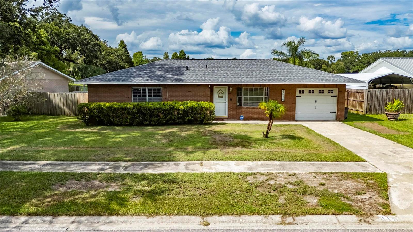 Welcome to 4819 Presidential St – a beautifully updated 2-bedroom, 2-bathroom home offering 1,087 sq. ft. of living space, a new roof (2025), AC (2021), and the freedom of NO HOA or CDD fees. Inside, the chef’s kitchen stands out with stainless steel appliances, rich wood cabinetry, granite countertops, and updated tile flooring that seamlessly extends into the dining area. The living room boasts elegant crown molding and brand-new LVP flooring (2025), providing a fresh, modern touch. The spacious primary bedroom also features new LVP flooring and a private ensuite bathroom complete with a new vanity, updated tile, and a shower with a built-in sitting area. The secondary bathroom has been tastefully remodeled as well, ensuring both comfort and style throughout the home. A new rear sliding glass door opens to your backyard retreat, where you’ll find a fully fenced yard and a convenient storage shed. Step outside and take in the serene water views of the pond, the perfect setting to watch ducks and birds, or to launch your kayak or john boat for a peaceful day of fishing and relaxation. The outdoor space is ideal for enjoying quiet mornings with a cup of coffee or entertaining friends and family in the evenings. This home is also ideally located within walking distance to East Point Little League, Mango Dog Park, and Mango Recreation Center, and just a short drive to shopping, dining, and everyday conveniences. With quick access to both I-4 and I-75, commuting to Tampa, Brandon, or surrounding areas is effortless. Combining modern upgrades, natural beauty, and a prime location, this home truly has it all, don’t miss your chance to make it yours!