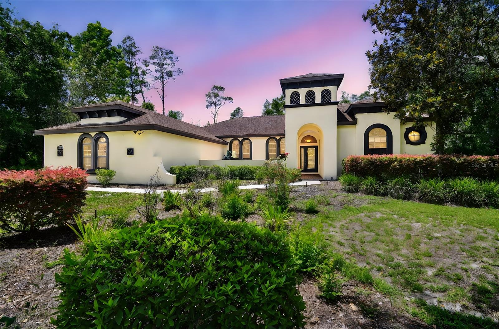 Stunning Custom Estate in Timberwood Acres! Welcome to your dream home nestled on 2 acres of serene woodland in the impressive Timberwood Acres community. This gorgeous custom-built estate features 4 bedrooms, 3 full bathrooms, a den/office, a spacious media room, and a 3-car garage, offering luxury, comfort, and privacy in one exceptional package. Tucked away on a peaceful cul-de-sac with lush landscaping and a courtyard entry, this home boasts a sprawling split floorplan perfect for both everyday living and entertaining. Step into the front of the home to find elegant formal living and dining rooms, a private den/office, and the expansive Owner’s Suite. Throughout the home, you'll find beautiful hardwood flooring, new interior paint, whole house sound system, and sliding glass doors along the back that provide constant views of the stunning pool and backyard oasis. The Owner’s Suite is a true retreat, offering two walk-in closets and a recently remodeled spa-like ensuite complete with quartz countertops, a garden tub, and luxurious finishes—perfect for unwinding after a long day. At the heart of the home is a bright and airy remodeled kitchen, featuring quartz countertops, premium stainless steel appliances, decorative tile backsplash, and elegant pendant lighting. The kitchen-family room combination creates a seamless space for entertaining and gathering. Just off the kitchen are two additional spacious bedrooms and a full bath, ideal for family or guests. At the rear of the home, you'll find another bedroom, a pool bath, and a massive media room—perfect for movie nights, game days, or hosting friends. Step outside and experience your own private resort-style oasis. The heated saltwater pool and spa with rock waterfall invite relaxation, while the outdoor kitchen and expansive lanai provide the perfect backdrop for entertaining—all set against the tranquil views of the surrounding wooded property. The oversized 3-car garage is designed with custom flooring and built-in shelving, offering excellent storage and space for your grown-up toys. This exceptional home offers luxurious estate living with unmatched privacy, all just minutes from the Suncoast Parkway, SR-52, and convenient access to Tampa, local shopping, dining, golf courses, parks, and Florida’s renowned Gulf Coast beaches. If you're looking for peaceful, upscale living without sacrificing convenience—this home has it all. Schedule your private showing today!