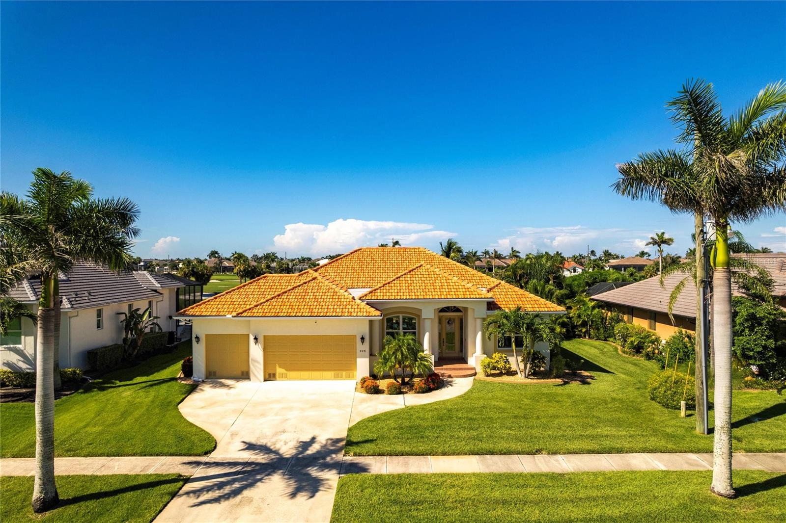 Welcome to 325 Madrid Blvd – a beautifully maintained 3-bedroom, 2.5-bath pool home with a spacious 3-car garage, located in the highly sought-after, deed-restricted community of Burnt Store Isles in Punta Gorda. This property offers over 2,000 square feet of thoughtfully designed living space and is in outstanding condition, showcasing true pride of ownership throughout. With a fully transferrable flood policy,
Recent improvements include a new roof (2022) and updated HVAC system, ensuring comfort and efficiency. The home also features full home shutter protection, generator hookup, and a multi-zone irrigation system to keep the lush landscaping looking its best.
Inside, the home offers a functional split-bedroom floor plan with multiple living and dining areas. The kitchen wraps to a cozy family room, while formal living and dining rooms provide elegant spaces for entertaining. Sliding doors lead to a screened and heated pool with pond views and peaceful golf course fairways—an ideal setting for relaxing and outdoor dining. The spacious primary suite includes direct access to the lanai, dual walk-in closets, and a well-appointed en-suite bath. Guest bedrooms are privately situated on the opposite side of the home, with convenient access to a full bathroom and a separate half-bath with access to the pool deck for outdoor convenience. Additional features include a three-car garage with abundant storage and a laundry room with utility sink. The home is connected to city-maintained water and sewer services. Burnt Store Isles is known for its upscale homes, wide sidewalks, and optional membership at Twin Isles Country Club, offering golf, tennis, and a full calendar of social events. Just minutes from downtown Punta Gorda, waterfront parks, marinas, shopping, dining, and I-75, this home offers a perfect blend of location, lifestyle, and low-maintenance luxury.
Don’t miss this opportunity to own a move-in ready home in one of Punta Gorda’s premier communities.