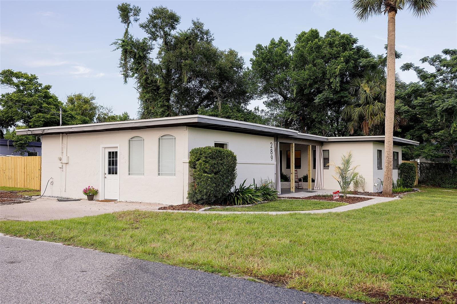 Freshly painted home on a large corner lot with updated landscaping. Offers 1,564 sq. ft. of living space with wood floors in main living areas, a spacious bonus room, and plenty of natural light. Move-in ready with great curb appeal!