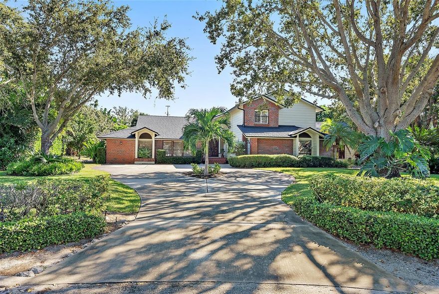 A rare opportunity to own a home in Riverview landings! Located at the Historic Desoto National Park and just a few miles to Anna Maria Island. This stunning and unique property is your personal oasis ready for entertaining. Updated and maintained to perfection, you can't get any better than this! The first floor gives you access to your expansive primary bedroom and ensuite with jacuzzi tub and dual sinks; providing access to the 4th bedroom that can easily be an office/den/nursery/gym. On the main floor you will also find your meticulously updated kitchen and massive living/entertaining space boasting a built-in wet bar with 2 wine fridges and pool table; this space can be your family room or the ultimate man cave! Each space has vaulted ceilings and French doors that open to the incredible saltwater pool with a waterfall feature and access to a HALF-ACRE of private maturely landscaped greenspace. Upstairs you will find two additional bedrooms with vaulted ceilings and an open landing overlooking your entryway and kitchen. Outside of the carefully curated floorplan the current homeowners have made some updates you don't want to miss: New hardwood flooring in the primary bedroom that runs seamlessly with the travertine stone and hardwood floors throughout. A brand-new stone coated metal roof, new pool pump, salt cell & pool cage all in 2025. Plus, two new Trane Air conditioners installed in 2024. The kitchen has had a stunning refresh with a Subzero refrigerator, Taj Mahal quartzite countertops, a 2-story pantry along with a stunning wine cellar/closet added in 2024. This home will provide you with HALF AN ACRE of land to call your own, tucked in a family-oriented neighborhood on a quiet cul de sac in a NON-FLOOD ZONE! Bring your kayaks, family and friends, this property is one you won't find very often!