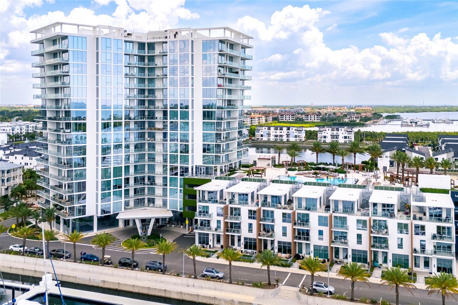 Welcome to your new waterfront retreat at Marina Pointe in Tampa’s lively Westshore Marina District. Sitting on the 9th floor, this home offers stunning views of Tampa Bay and the downtown skyline. As you step inside through your private elevator foyer, you'll find nearly 2,000 square feet of luxurious living space crafted for comfort and elegance. This spacious condo has 3 full bedrooms, 2.5 bathrooms, and a large living area perfect for relaxing or hosting friends and family. The modern kitchen boasts European-style soft-close cabinetry, high-end appliances, a large quartz island with a waterfall edge, which smoothly transitions into the living room. Floor-to-ceiling windows fill the space with abundant natural light and breathtaking sunsets, creating a warm and inviting atmosphere.
Step out onto the large balcony from the living room and take in sweeping views of the Bay, the Marina, and downtown Tampa’s skyline. From the owner's suite, you can also access the terrace and enjoy water and downtown views that are exquisite at any time of day. The master suite is spacious, offering plenty of room for large decor. Additionally, there are two closets that have been customized to maximize organization.
The master bathroom features double vanities, quartz countertops, and a luxury soaking tub in the sleek glass-enclosed shower. The two other bedrooms have plenty of space, floor-to-ceiling windows with amazing views, built-in closets that have also been customized, and share a Jack-and-Jill bath.
Additional highlights include beautiful wood-look tile throughout the main living areas, soaring 10-foot ceilings, motorized window shades, a powder bath for your guests, and two assigned parking spaces.
Marina Pointe features 24/7 onsite staff, a clubhouse, a virtual golf simulator, a business room, a private massage studio, a steam room, a state-of-the-art fitness center, an oversized resort-style pool, and a Jacuzzi overlooking Tampa Bay. Additional amenities include a gas grill area, bocce courts, a secure off-leash dog park, and more.
Located just minutes from downtown Tampa, Tampa International Airport, St. Pete, and Florida’s beautiful beaches, this community offers both convenience and luxury. For boaters, there’s a deep-water marina with easy access to the bay. This community provides access to a lively scene of shops and dining within the Westshore Marina District.
Don’t miss your opportunity to own an exceptional unit in one of the best buildings in Tampa. Schedule your showing today and make this dream condo yours!