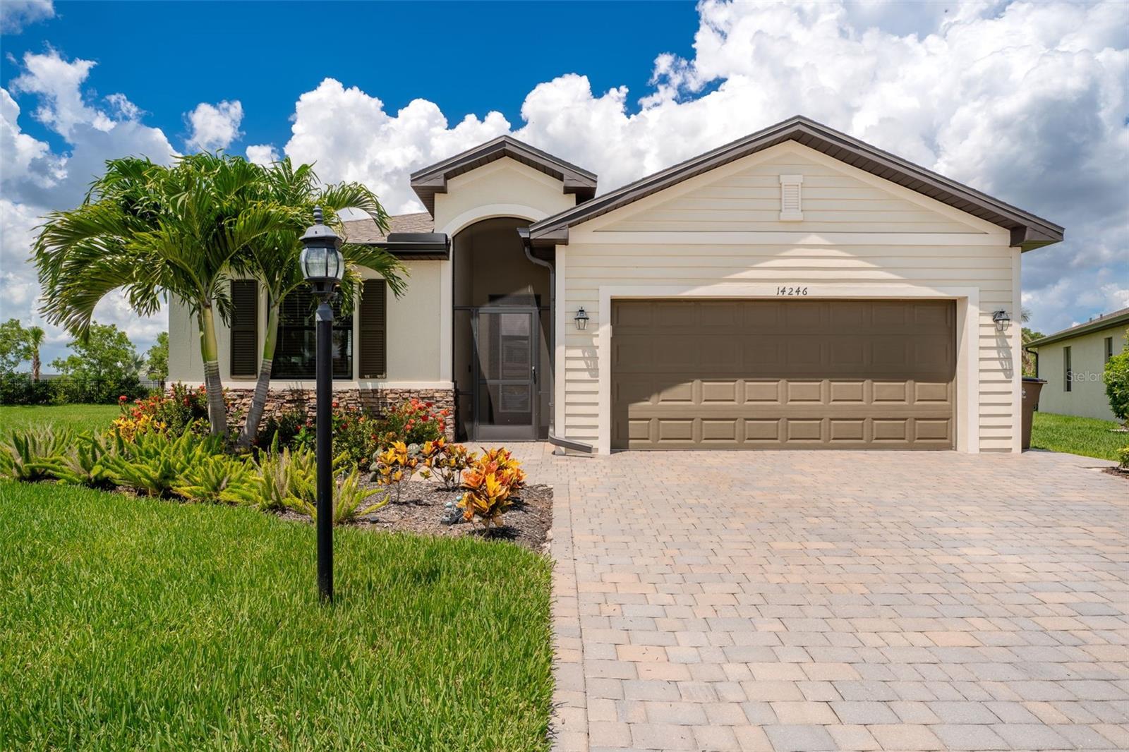 Tucked away on an oversized, private lot in the sought after gated community of Portico, this beautiful 3 bedroom, 2 bathroom Pool home offers the perfect blend of comfort, style, and convenience. From the moment you arrive, the paver driveway, screened front entry, and lush surroundings set the tone for the peaceful lifestyle that awaits. Inside, you'll find tile flooring throughout the main living spaces, complemented by brand new luxury vinyl plank in the bedrooms and elegant crown molding that adds a touch of sophistication. The split bedroom floorplan ensures privacy for all, with a spacious primary suite featuring a large walk in closet, dual sinks, a soaking tub, oversized shower, and private water closet. The heart of the home is the expansive kitchen, perfect for entertaining and offers stainless steel appliances (including a new dishwasher), a generous pantry, window over the sink, a peninsula for extra seating, and enough space for a breakfast table. The lovely dining area flows seamlessly into a bright, airy living room with sliders that open to the backyard oasis. Outside is the large under truss lanai, perfect for grilling or lounging, overlooking the heated pool and spa with LED lighting and ideal for year round enjoyment. The backyard is incredibly private, offering a serene escape. Additional highlights include 2 guest bedrooms and a full bathroom that conveniently doubles as a pool bath. A 2 car garage equipped with a home gym that's available to purchase with the home. Furnishings are optional as well for a turnkey experience. As part of Portico community, you'll enjoy fantastic amenities including a resort style pool, fitness center, tennis, pickleball, playground, and more. Don't miss your chance to own this beautifully maintained, move-in-ready home that checks every box!