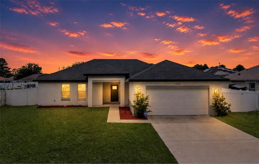 NEWER CONSTRUCTION + SELLER FINANCING AVAILABLE in the heart of Deltona!
Welcome to this stunning 2023-built home located at 1792 Villa Dr, Deltona, FL — offering 3 bedrooms, 2 bathrooms, and 1,685 sq ft of modern luxury living designed with style, comfort, and functionality in mind.

Step inside and fall in love with the bright open-concept layout, soaring ceilings, oversized porcelain tile flooring, and upscale designer finishes throughout. The gourmet kitchen features sleek white shaker cabinetry, quartz countertops, stainless steel appliances, oversized island seating, modern pendant lighting, and an open flow perfect for entertaining.

The spacious primary suite feels like a private retreat with tray ceilings, spa-inspired ensuite bath, dual vanities, and a luxurious walk-in shower with floor-to-ceiling tile. The additional bedrooms are generously sized with modern finishes and abundant natural light.

Enjoy indoor-outdoor Florida living with sliding glass doors leading to a covered lanai and fully fenced oversized backyard — perfect for pets, gatherings, or creating your dream outdoor oasis.

Conveniently located near shopping, dining, schools, I-4, Orlando, Daytona Beach, and the beaches, this move-in ready home combines modern elegance with everyday convenience.

SELLER FINANCING AVAILABLE — a rare opportunity for buyers looking for flexible financing options!
