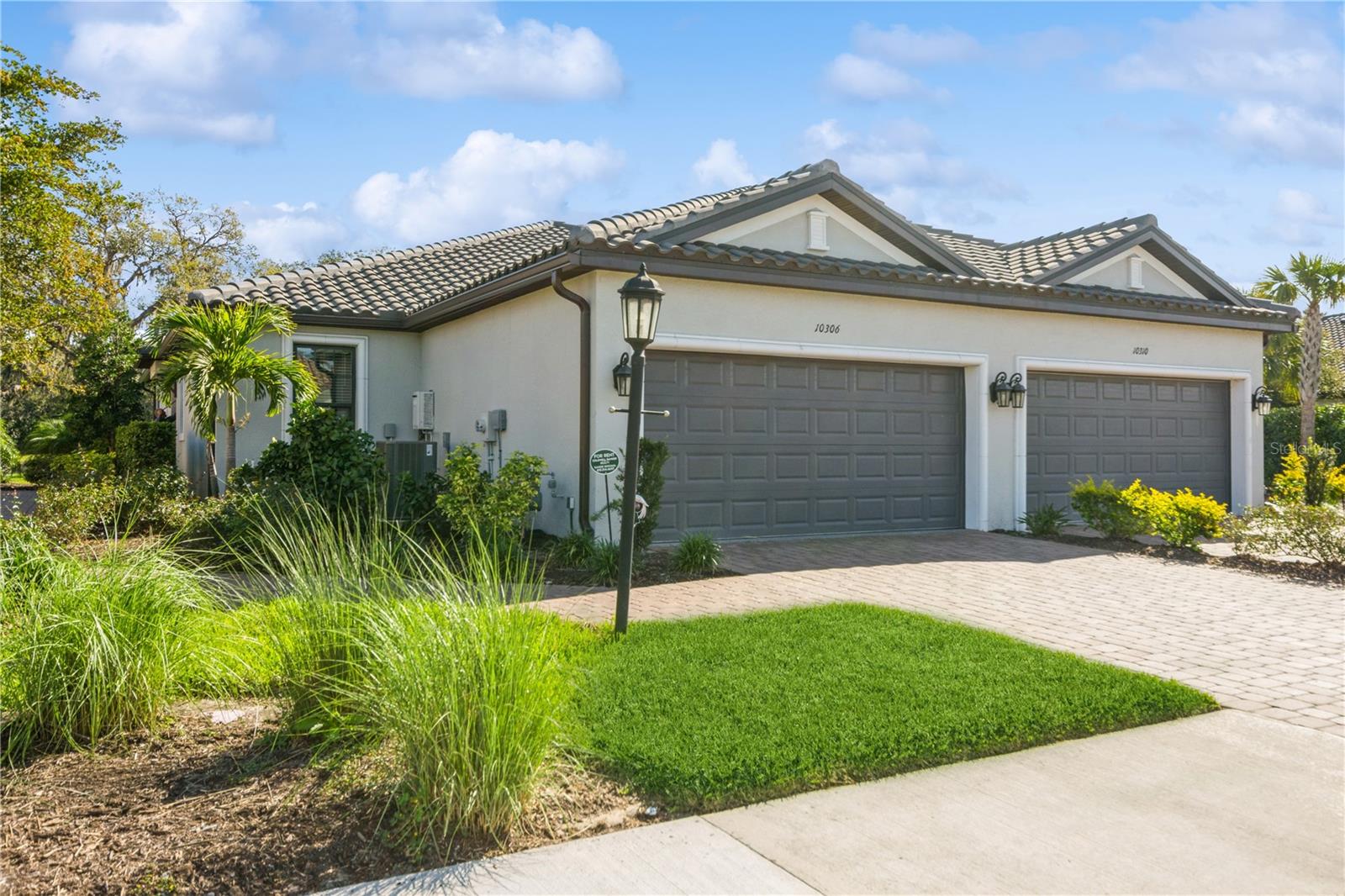 Relax and enjoy this FURNISHED villa nestled within the popular resort-style Skye Ranch community. This lovely turnkey 2 bedroom/2 bath/2 car garage offers a unique blend of modern elegance and serene comfort. Featuring an inviting floor plan accentuated by a picturesque backyard water view, this home welcomes you with a spacious gathering room, lovely kitchen with island and separate dining area. Plus, the den or study can be used for additional accommodations with it's privacy pocket-doors. The heart of this home lies in the kitchen, with quartz countertops and equipped with stainless steel appliances. Enhancing the ambiance, both bedrooms, gathering room and study have ceiling fans to gently circulate the air throughout. Serenity awaits as you step outside into the oversized screened-in lanai and immerse yourself in tranquility as you overlook the water view and lovely foliage from the wetlands, creating an idyllic backdrop for friendly gatherings or moments of peaceful reflection. This home is a short walk to the Esplanade only Rendezvous Park, featuring a pool, spa, bocce ball, firepit, dog park and pickle ball courts. Additionally, you also get access to the resort-style pool at The Hub, featuring water bucket fun, spa, lap lane pool, state-of-the-art fitness center, rock climbing wall, cafe and more. Plus, access to Turner Park with it's own dog park, playground, sand volleyball courts, basketball courts, more pickle ball courts and sports fields for baseball, soccer and football. And, miles and miles of trails throughout the community!! Whether enjoying the vibrant resort-style community amenities or enjoying quiet evening at home, this home epitomizes modern living at it's finest, offering a harmonious blend of luxury and relaxation in an unparalled setting. Whether you're wanting to experience living in the area or waiting on your new construction home to be finished, this villa is a fantastic option.