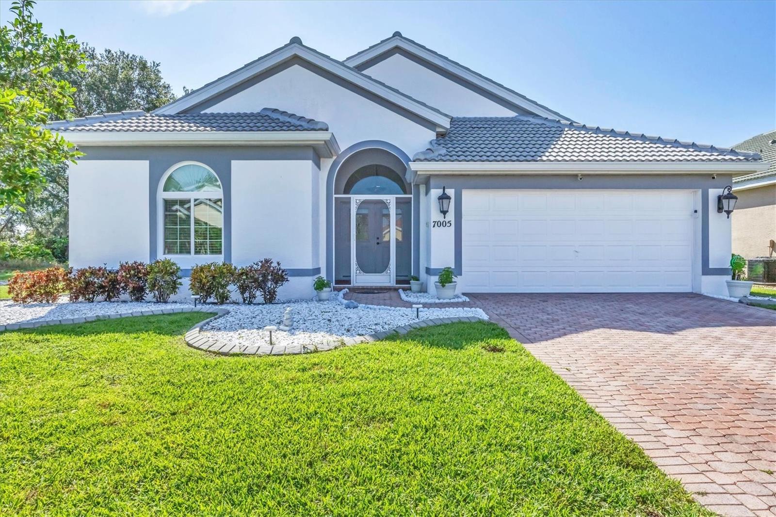 Newer tile roof? Check. Hurricane impact doors and windows? Check. Whole-home generator? Check. This updated lakefront home in Mote Ranch with extensive upgrades checks off all the boxes. Welcome to Mote Ranch, where this Biscayne model by Lennar Homes is set on a private lot with tranquil lake views. Thoughtfully updated throughout, this home offers comfort and convenience in one of Sarasota’s accessible locations. There are three bedrooms plus a media room that could be used as office or fourth bedroom. Enjoy the water view from the huge, extended lanai with hurricane shield shutters. Recent enhancements include a tile roof installed in 2023, a newer air-conditioning system, hurricane-impact windows and doors, and a full-house generator, so never worry about losing power or an approaching storm. A liquid siding paint application adds lasting protection and curb appeal, complemented by decorative curbing and gutters installed around the entire home. Inside, the open layout features luxury vinyl plank flooring, tile in the living and dining areas, and wood flooring in the primary bedroom. The kitchen has been fully remodeled with contemporary finishes, and the laundry room and guest bath have also been updated to today’s standards. Additional features include battery-operated window treatments, privacy pulldown garage door screen, epoxy garage flooring, surround-sound system, security cameras, reverse osmosis water in the kitchen, whole-house water softener, and a Sharp 80-inch 3D color television. This home is just minutes from University Town Center, Interstate 75, Sarasota–Bradenton International Airport, downtown Sarasota and the Gulf Coast’s renowned beaches. Mote Ranch residents enjoy low HOA fees, access to a community pool, kayak launch and recreational trails along the Braden River.