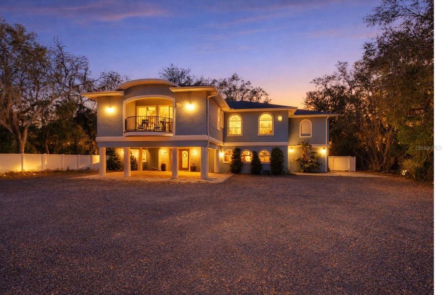 RARE OPPORTUNITY TO OWN A WATERFRONT ESTATE IN THE HAMMOCK. No HOA and perfectly positioned where the Northern Cut intersects the Intracoastal Waterway in the coveted Hammock area. This extraordinary estate delivers 180-degree water views, world-class sunsets, and outstanding improvements that cannot be replicated at this price. Sitting on a 639-foot-deep, 100-foot-wide parcel totaling approximately 1.47 acres with 100 feet of direct ICW frontage. The property offers privacy and unparalleled versatility.  Newer 2 story dock with electricity and covered boat lift is the perfect spot to enjoy dolphins and manatee right from your own backyard! 
The custom-built, remodeled two-story home offers over 2,700 square feet of living space designed to provide expansive views of the water. Upon arrival, a cobblestone portico welcomes you into a foyer that leads up the stairs to breathtaking views of the water.  The main living areas are open, bright, and oriented toward the river, anchored by a show-stopping kitchen featuring solid surface counters, custom lit cabinetry, a large center island, wine cooler, and newer stainless steel appliances.  The primary suite has stunning ICW views, a custom walk-in closet, and French doors opening to an upper deck.  The en-suite bath features a garden jetted tub and newly remodeled oversized shower with double vanities. Two additional guest bedrooms each enjoy their own remodeled bathrooms.  A dedicated office has views fo surrounding trees and nature. Downstairs, a private oversized in-law suite with its own full bath provides ideal multi-generational flexibility. The oversized side entry 3-car garage provides plenty of storage for toys and vehicles.  Farm to table living is easily attainable with a vegetable garden with irrigation and fishing off the dock.  Seller had chickens that provded eggs for local restaurants and their bees supplied “Hammock Honey”.  There is a newer 2000 sq ft insulated metal barn with 150 amp electrical power and workshop area.  Current owners added a  2024 trex finished two story dock with covered boat lift, electricity, and bait cleaning station.  Large backyard is fully fenced with firepit area.  Well with pump.  100 and 500 gallon buried propane tanks. Newer whole  house generator for piece of mind.
These properties don’t come along often - if you have been dreaming of riverfront living on the beachside of The Hammock this is the one!