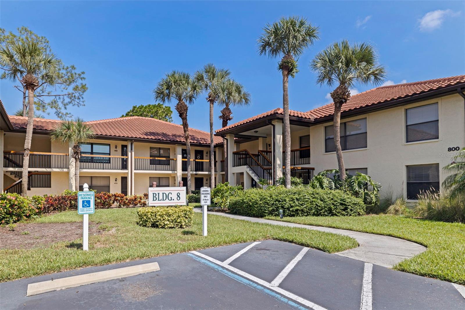 Updated Corner Condo in a Serene Gated Community! Welcome to a beautifully renovated second-floor corner unit tucked within the tranquil, tree-lined gates of Hammock Pine Village. This spacious 2-bedroom, 2-bath condo combines modern updates with timeless Florida charm. Step inside to discover a bright and airy open layout, featuring a 2022 full renovation, new AC system (2022), and electrical updates (2018) for peace of mind. The corner-unit placement offers extra privacy, abundant natural light, and views of the lush landscaping from every window. The kitchen and bathrooms have been thoughtfully updated with stylish finishes, and the private screened-in balcony is the perfect spot for morning coffee or sunset relaxation. Hammock Pine Village offers resort-style amenities, including a sparkling pool and spa, tennis courts, and well-maintained grounds with walking paths shaded by mature oaks. This gated community is conveniently located just minutes from US-19, making it easy to access Clearwater Beach, Downtown Dunedin, Safety Harbor, shopping at Countryside Mall, and countless dining options. Whether you're seeking a low-maintenance primary residence or a seasonal getaway, this move-in-ready gem delivers comfort, convenience, and community.