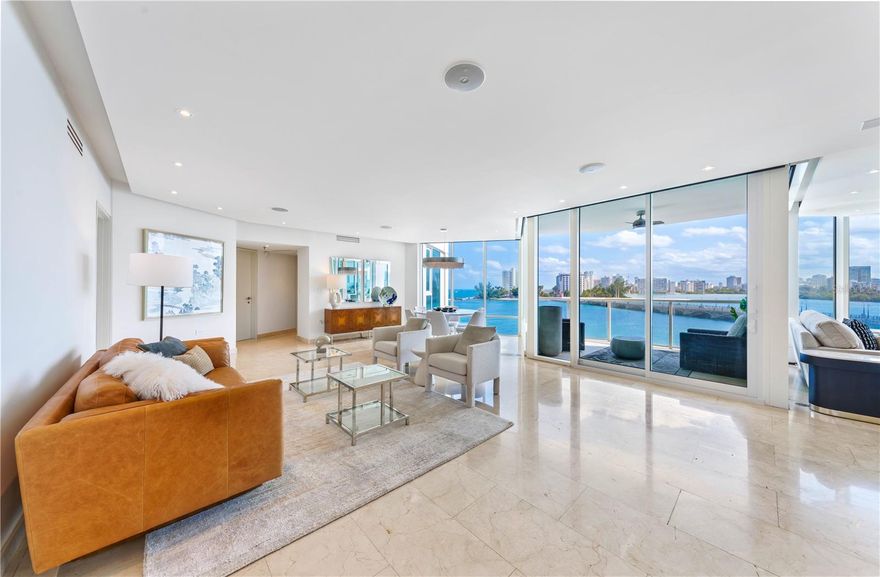 ***SOLD*** Experience refined coastal living in this beautifully designed 4-bedroom, 2.5-bathroom residence at Laguna Plaza. Located in Condado Beach, this stunning apartment offers 2,752 sq. ft. of meticulously crafted living space with breathtaking views of the ocean and lagoon, El Yunque mountain range, and city skyline. A private elevator with key access opens directly onto your exclusive landing, ensuring unmatched privacy and convenience. East facing, the residence is perfectly positioned to capture the beauty of the sunrise, filling the home with warm, natural light every morning. Floor-to-ceiling glass windows bathe the interiors in Caribbean sunshine, creating a seamless connection to the vibrant surroundings. The open-concept design combines modern elegance with comfort, making it ideal for both relaxing and entertaining. A chef’s kitchen with premium stainless steel appliances anchors the space, while the bedrooms are designed to provide tranquility and privacy. This upgraded and re-envisioned residence comes fully turn key, inclusive all of furniture and design. Laguna Plaza is one of San Juan’s premier waterfront luxury buildings, offering an array of world-class amenities, including 24/7 concierge service, a full doorman experience, an outdoor pool, a state-of-the-art fitness center, a resident lounge, and secure underground parking. This exceptional residence combines sophistication, style, and the beauty of Condado Beach living.