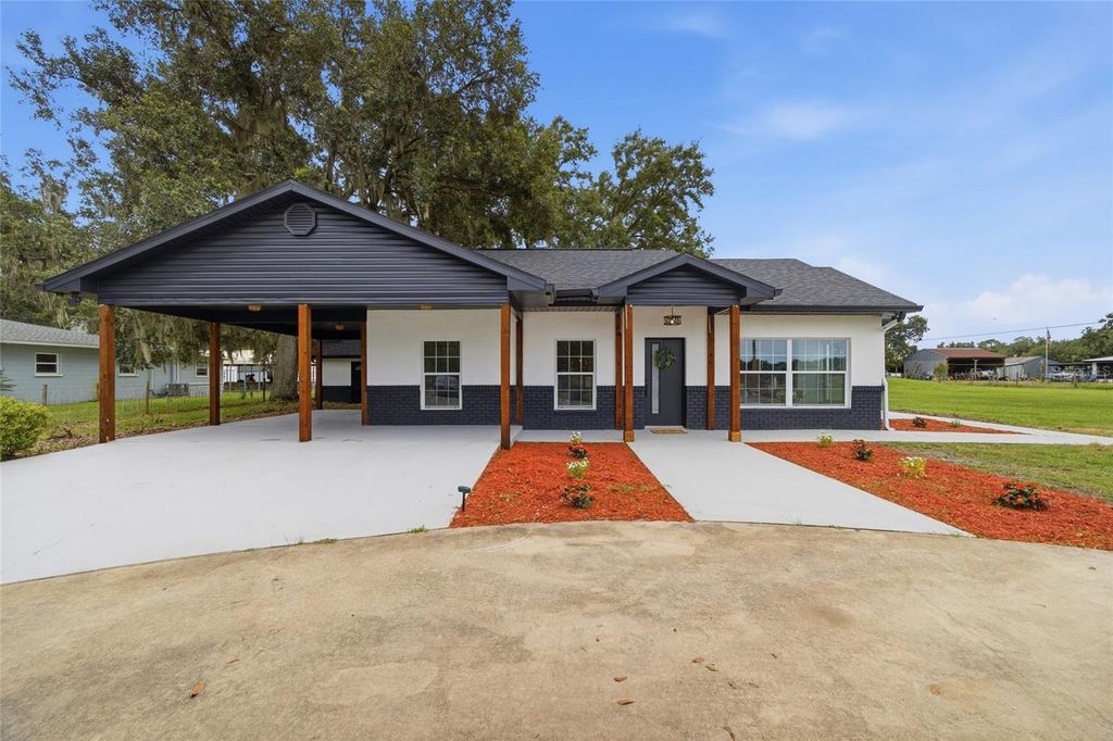 Photo of 1205 E Knights Griffin Road, Plant City, FL 33565 (MLS # TB8518134)