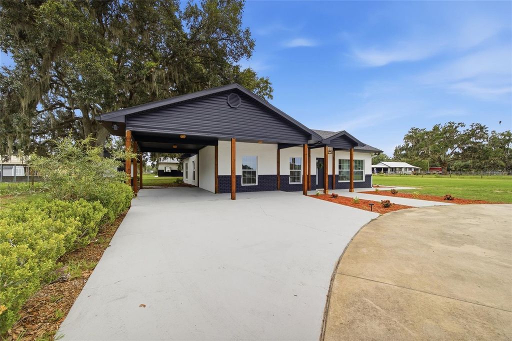 Photo of 1205 E Knights Griffin Road, Plant City, FL 33565 (MLS # TB8518134)