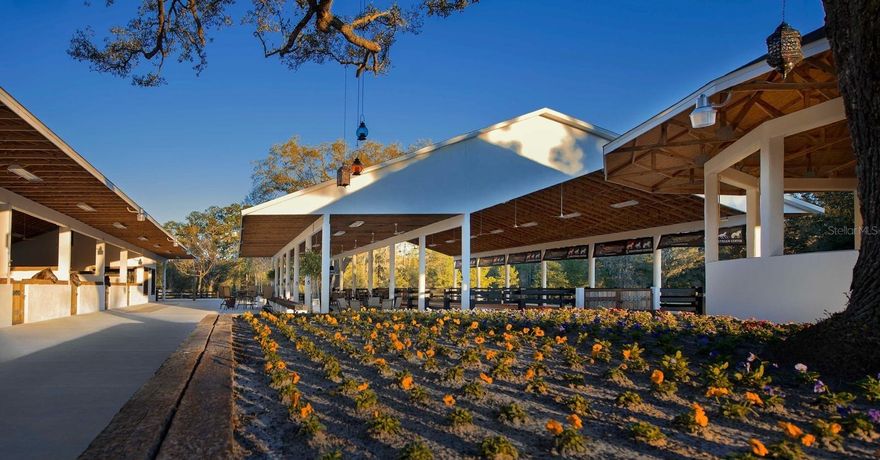 Discover Sociagro Equestrian Center, a luxury equestrian estate and event facility located just 25 minutes from the World Equestrian Center in Ocala, Florida. This extraordinary property spans 14.71 acres of fully functional equestrian land, divided into 10 fenced paddocks with automatic water access, double perimeter fencing, and two gated entrances for privacy and ease of access. Internal driveways allow you to tour the property comfortably by vehicle.
Designed for both training and entertaining, this turnkey equestrian facility offers a barn with 10 oversized 16x16 stalls, a fully furnished 360° glass office with panoramic views, custom-built desks and dining for 20, and two air-conditioned restrooms separated for men and women.
The property features a climate-controlled tack room, air-conditioned kitchen with quartz buffet counter, Alfresco 56” barbecue, ceramic pizza oven, three outdoor refrigerators (wine + beverage), and main kitchen refrigerator — ideal for gatherings and equestrian events.
Additional amenities include a climate-controlled storage area, three foam-insulated storages, and a stainless-steel veterinary chute built to international standards.
The covered arena features an under-roof spectator area with seating and lounge space, while the round pen includes an elevated viewing balcony and covered saddling area. Perfect for clinics, private events, or professional equestrian activities.
This property also includes a well, septic tank, and a retention pond for efficient water management and drainage. Dedicated parking areas for guests and a concrete trailer parking zone complete the setup.
Every structure was built with precision, prioritizing comfort, functionality, and sophistication. With its strategic location near the World Equestrian Center, this estate is ideal for trainers, breeders, or investors seeking a luxury equestrian and event center in the heart of Horse Capital of the World – Ocala, Florida.