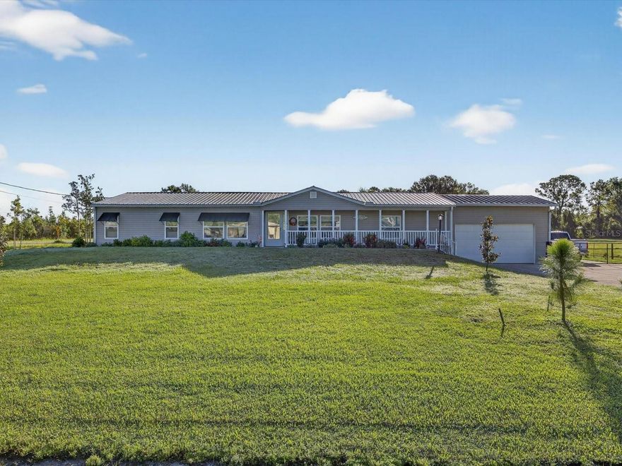 This exceptional 3-bedroom, 2-bath home with so many upgraded features, sits on just over an acre and offers the ideal balance of comfort and versatile Florida living. The property features a spacious 3-car garage  and a  700 sq. ft. detached building complete with electric, plumbing and a private office space — perfect for a workshop, studio, or home business. Inside, the open floor plan flows seamlessly, with natural light from the all new energy efficient double pane windows throughout the home, highlighting the well-appointed living areas remodeled with new luxury vinyl planking and brand new interior paint. The kitchen complete with large walk in pantry has been completely outfitted with new cabinets, crown molding, granite counter tops, farm house sink, stainless steel appliances all in 2023.  The private primary suite offers a relaxing retreat, with barn door to an extra large walk in closet. The en suite bathroom has double sinks, stand alone shower and soaking tub. while two additional bedrooms share a common full bathroom and provide flexibility for family or guests.
Step outside to enjoy a screened-in patio overlooking the sparkling private pool, all within a fully fenced backyard with automatic solar powered front gate, perfect for gatherings, pets, or simply enjoying your own outdoor oasis. The siding was replaced on the exterior of the home 2024, gutters added to exterior 2024, new pool pump 2024, well replaced 2023 with new water softener and chlorine filtration system all 2023. Septic pumped and inspected 2023, Roof 2015, AC 2018. All ductwork below the home replaced in 2023. There is a 50 amp hookup just outside the back door for a whole home generator. Plenty of space on the driveway that wraps around the home to store boat or RV with full RV hookup. Located just off the back of the home is a 700 sq ft building with electric and water with built in dog run between the home and building perfect for grooming or pet business. There is also a shed on the property with built in shelving for extra work space and a carport with additional 6x8 shed for storage. Located in a peaceful setting near private Lake Lowery still close to shopping, dining, golf, and Central Florida attractions, this property is a rare find. With its acreage, pool, and detached multi-use building, it offers opportunities you won’t find in a typical neighborhood home.