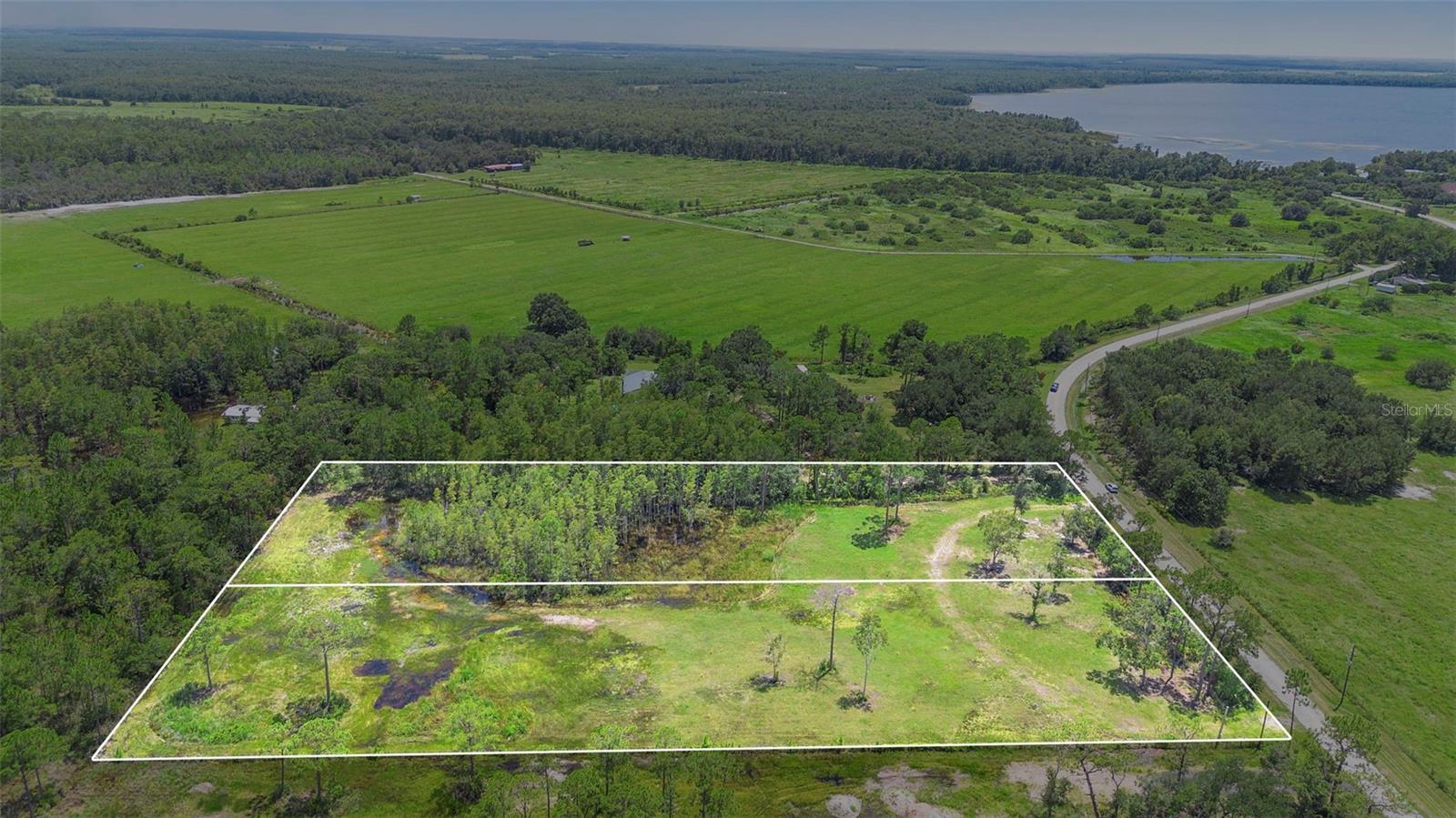 *TWO LOTS BEING SOLD TOGETHER* This 4.57-acre property offers a private, wooded retreat, ideal for building your dream home or peaceful getaway. Enjoy the serenity of nature while being convenient with easy access to a paved road. Close to shopping, dining and other essential amenities, this lot provides the best of both worlds, privacy and convenience. Near public boat ramp. This property offers a unique opportunity. Don't miss out on this rare find in a desirable location!