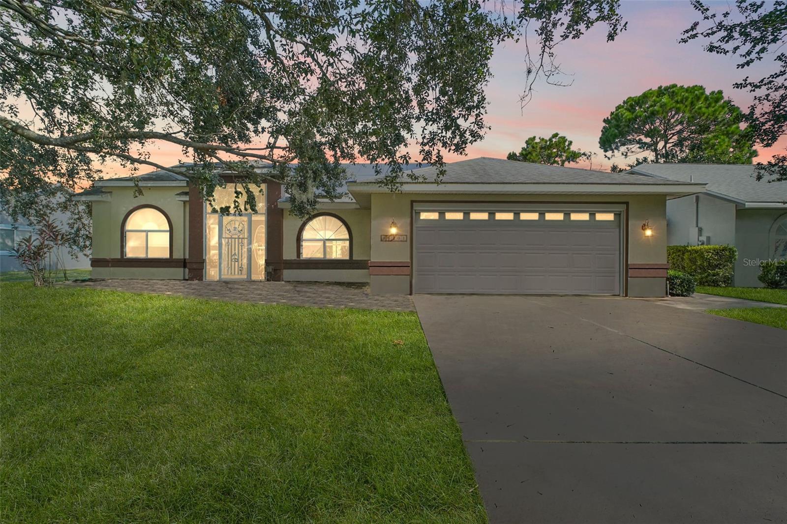 WATERFRONT POOL HOME with Two Primary Suites & Stunning Lake Views! This well-maintained waterfront home offers a perfect blend of comfort, functionality, and Florida lifestyle living. Featuring two primary bedrooms, this split-floorplan home is ideal for multi-generational living or hosting guests in style.
Step inside to a bright open-concept kitchen and family room, perfect for entertaining or enjoying everyday life. The kitchen boasts a center island, cozy breakfast nook, and ample storage. The family room includes an electric fireplace, adding a cozy touch to the heart of the home.
Expansive sliding glass doors lead you to the covered lanai, complete with skylights and a retractable screen, overlooking the sparkling pool and peaceful lake—a true indoor-outdoor retreat where you can enjoy bird watching, or launch a canoe or kayak right from your backyard.
The main primary suite includes a fully remodeled bathroom with dual sinks, a walk-in shower, and a spacious walk-in closet. The second bedroom also features a walk-in closet and convenient access to the hall bathroom. A third bedroom offers a full ensuite, ideal for a teenager, in-laws, or guests.
Additional highlights include: Indoor laundry room, plus laundry hook ups in the garage, Garage with EV charging station & split ac unit, Paid-off solar panels for low electric bills, Newer roof, New AC (approx 6 months old).
Schedule your private showing today!