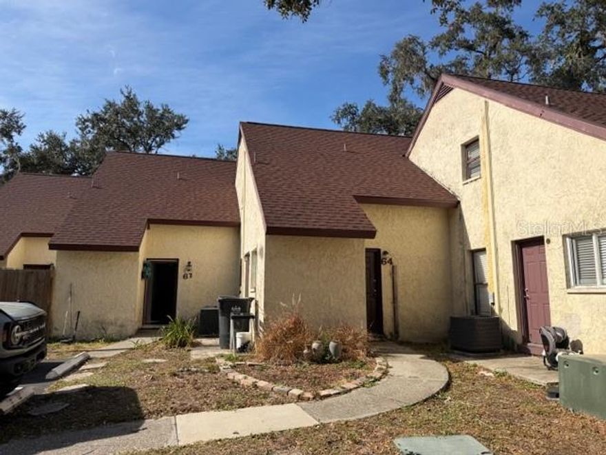 This tastefully updated townhome combines fresh updates, comfort, convenience, and a bright modern feel throughout. The main level features new flooring, a fully renovated kitchen with beautiful countertops, spacious open living area with vaulted ceilings. There is a flex space located off the living room perfect for a guest room, office, playroom, or extra storage.  For added convenience there is a half bath downstairs and a new washer and dryer. Upstairs you'll find two generous bedrooms with new flooring and plenty of natural light along with a well-appointed full bath. You can enjoy the outdoors with your fenced back patio, a private space ideal for relaxing or entertaining. The community offers a pool and clubhouse. Located near USF, major Tampa hospitals, I-275, public transit, shopping, restaurants, parks, and everyday conveniences. This area has a strong rental market, academic community, surrounding employment hubs, easy commutes to downtown Tampa and Wesley Chapel.Updated and MOVE IN READY