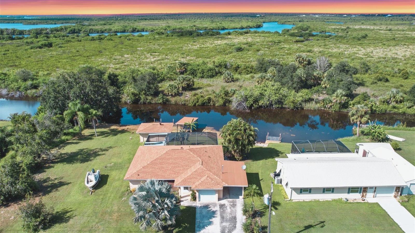 Check out this GULF ACCESS pool home situated on a spacious 0.28-acre lot in Punta Gorda’s desirable Peace River Shores! Enjoy the waterfront lifestyle with your own private boat ramp, making it easy to launch right from your backyard. Inside, the home features a comfortable 2 bedroom, 2 bathroom floor plan with plenty of natural light. A newer shingle roof (2023) provides added peace of mind. Perfect for entertaining, the large sunroom opens to the screened swimming pool area, creating the ideal space for gatherings. Outside, there’s ample room to store trailers, boats, or an RV, along with a large storage shed for all your extras. Don't miss this rare opportunity - schedule your tour today!