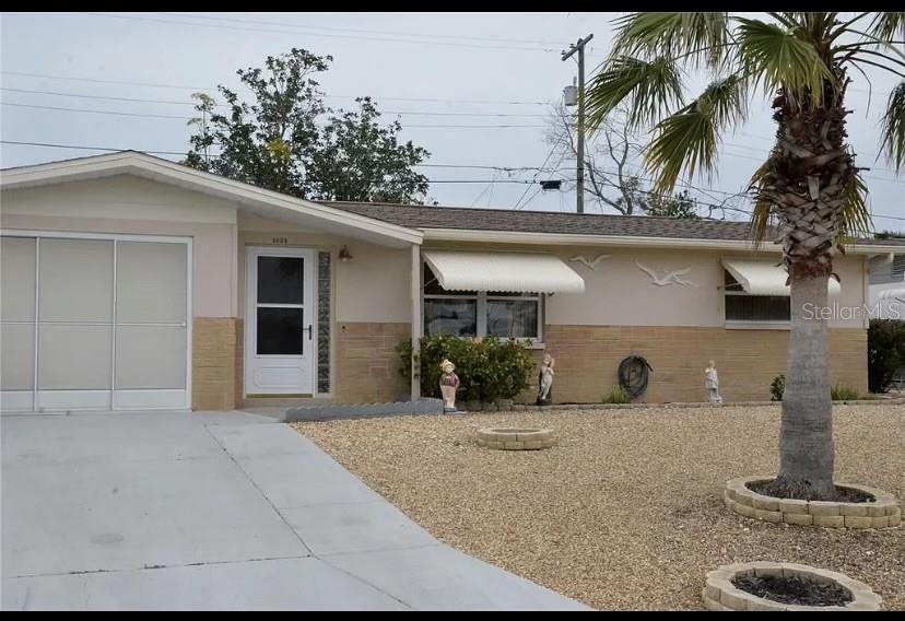 Gorgeously updated 3/2 furnished single family home in residential area -- even includes an in-law suite with a private side entrance. Most of the furniture and furnishings are newer and in very good condition and includes two flat screen televisions. If you enjoy and appreciate high end, stylish updates, you will really enjoy the updates made throughout the home. The back yard is completely fenced with half of it paved over so you can enjoy the outdoors without having to deal with annoying bugs or wet grass. The other half of the yard is pebbled so no lawn mowing is needed – only the front pebbled yard will require maintenance. Up to two dogs and one cat are permitted – with a $100 deposit per dog. No breed or size restrictions other than any imposed by any governing municipality. This stylish home is located on a quiet street but is a quick drive to shopping, Tarpon Springs/Sponge Docks, New Port Richey, Trinity and a myriad of restaurants. Sorry, but subletting of the in-law suite will not be permitted. All occupants of the property aged 18 and over must be approved prior to the commencement of the lease term. The storage building is for landlord's use only and tenant will not have access to it. Must see in person because the pictures simply do not reflect the stunning beauty of this home.