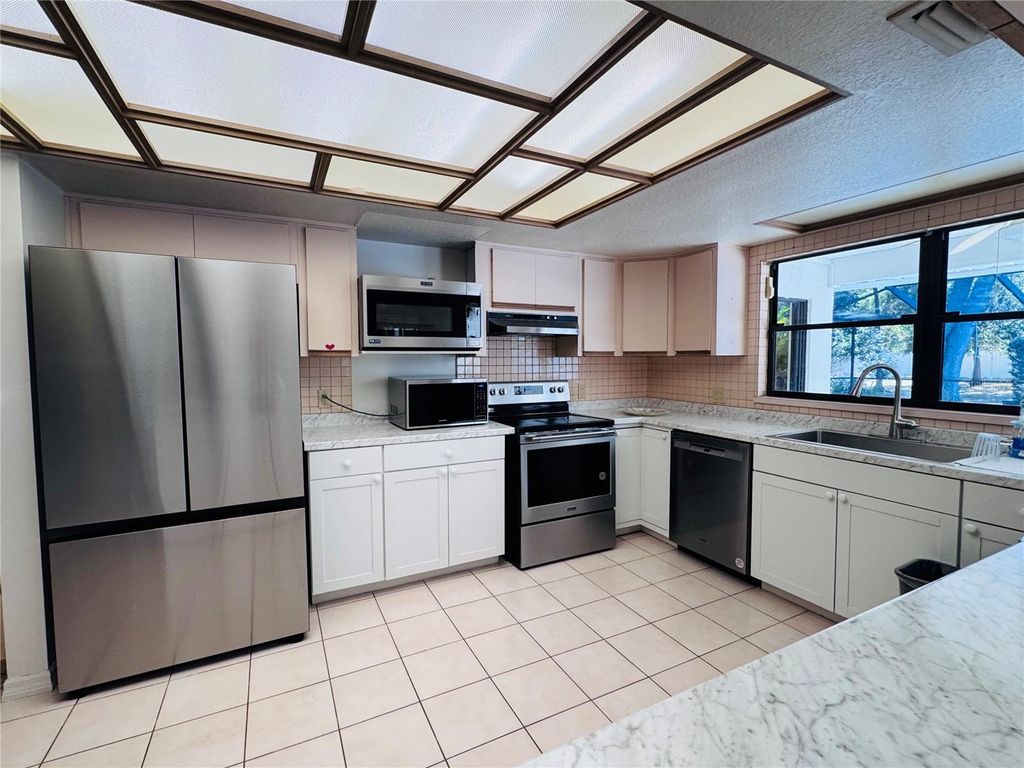 Photo of 2949 Sunset Point Road, Clearwater, FL 33759 (MLS # TB8448099)