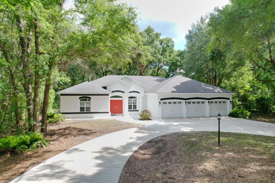Wonderful updated House with Mature Trees on Half an Acre, Features 3 Large Bedrooms 2 Bathroom, Cabana Bath, 3 Large Car Garage, a Partial Cover Screen Back Porch. Ac System, New Water Heater, All New Flooring through out, Gas Fireplace in Living with pass through Master Bedroom, New Luxury Laminate Flooring in all living areas, All Newer Kitchen Cabinets with New Granite Counter Tops, New Stainless Steel Appliances, The Interior has been Freshly Painting, The Exterior has been Freshly Painted, All this on a nice .54 Acre, Surrounded with mature, Fruit trees, Shopping centers nearby, and Rainbow Springs, State trails within a Walk/Bike short distance.