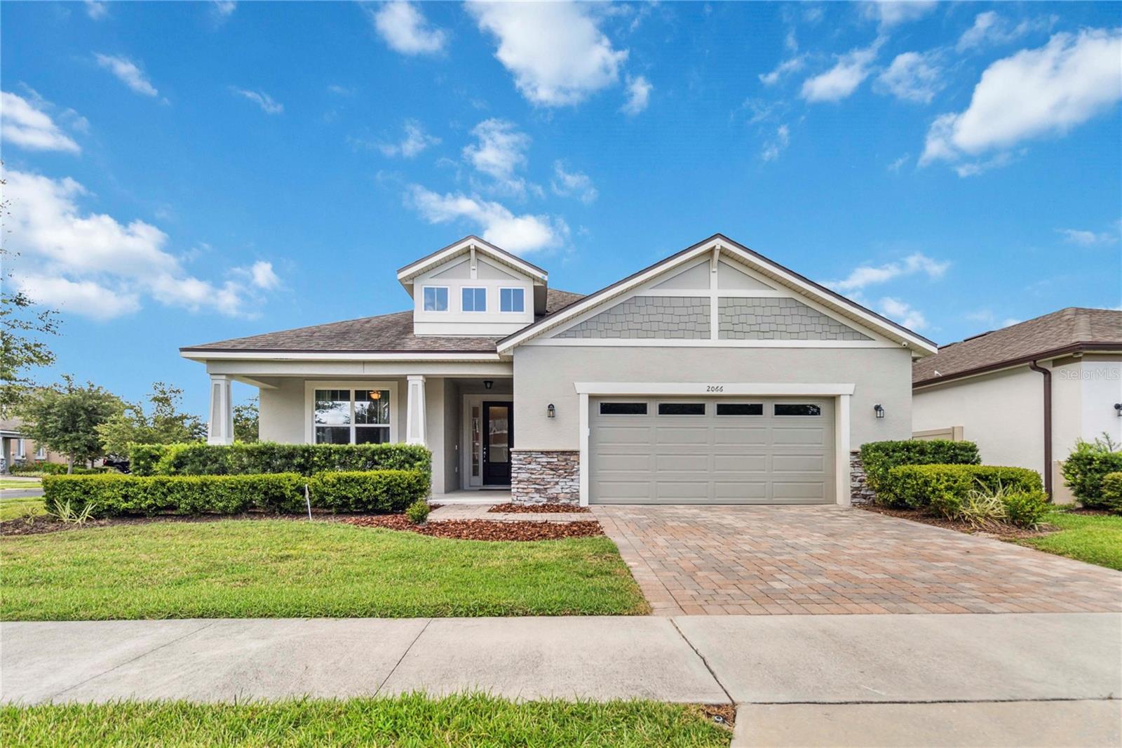 One or more photo(s) has been virtually staged. Welcome to this beautifully maintained 4-bedroom, 3-bathroom home nestled on a desirable corner lot in the gated community of Preserve at Crown Point. Offering 2,502 square feet of thoughtfully designed living space, this home combines comfort, style, and convenience. Freshly painted in 2025, the exterior makes a great first impression. Inside, you’ll find a spacious open floorplan with tile flooring throughout the main living areas and plush carpet in the bedrooms. The large gourmet kitchen is a standout, featuring a center island, sleek stone countertops, stainless steel appliances, a range hood, and ample cabinet space—ideal for cooking and entertaining. The formal dining room is enhanced by elegant tray ceilings, adding a refined touch to gatherings. The primary suite offers a peaceful retreat with an en suite bathroom featuring dual sinks and a walk-in glass shower. Outside, enjoy the benefits of a gated community that includes a pool and playground. Located just blocks from Lake Apopka, and minutes to Ocoee High School, shopping, dining, and grocery stores, this home is perfectly situated for convenience and leisure. Don’t miss your chance to own this move-in-ready home in one of Ocoee’s most sought-after neighborhoods!