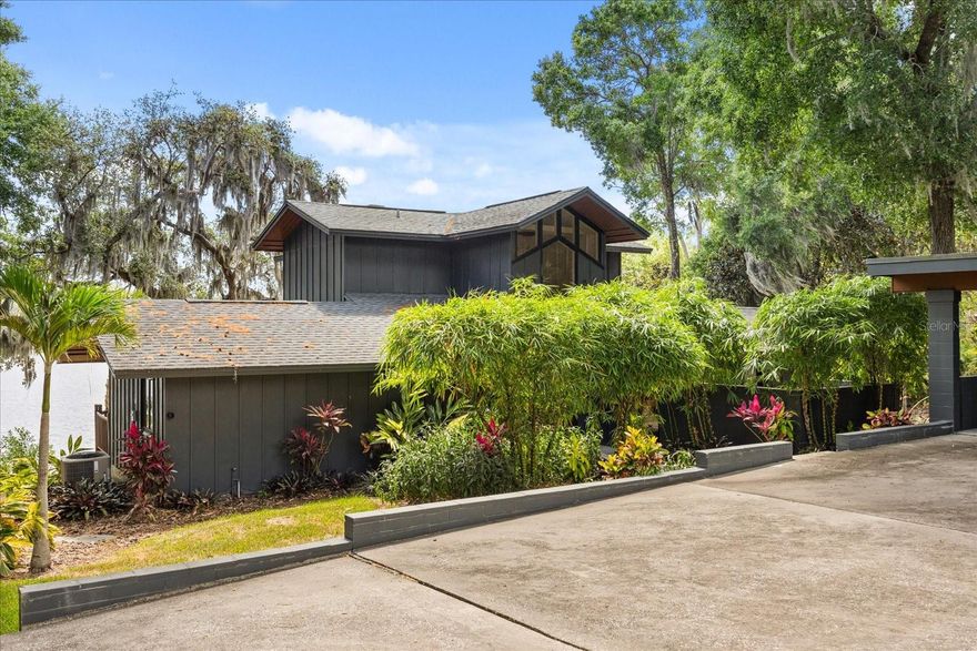 Why live in Florida... if you can't live on the lake? Welcome to your private lakefront oasis in Altamonte Springs—nestled on beautiful spring-fed Lake Florida, this stunning Frank Lloyd Wright-inspired tri-level modern home sits on a rare half-acre lot with no HOA. Designed with architectural character and contemporary comfort, this custom-built retreat is truly one of a kind. Step inside your 4-bedroom, 3-bathroom home and experience a seamless blend of timeless charm and thoughtful updates. The heart of the home is a gourmet kitchen equipped with high-end Viking appliances, ideal for both quiet family meals and entertaining guests. The open floor plan offers generous living spaces filled with natural light and breathtaking lake views. Wake up to peaceful mornings on one of several lake-facing balconies, or spend your evenings enjoying the sunset over the water. The tranquil setting offers a small-town feel with all the benefits of city living—just minutes from I-4, the Altamonte Mall, and downtown Orlando. This is more than a home—it's a lifestyle. Come see this architectural gem in person and discover the serenity of lakefront living. Roof 2025.