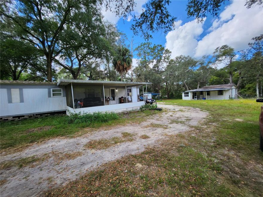 Super great investment property. Huge fenced corner lot. 1.26 acres, 2 homes, one built 1957 and the other built 1974. 1 structure is currently rented, the other one needs repairs. Must see. Lots of potential.