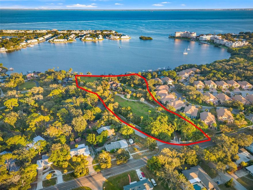 Owner financing with a min $3mil down. Magnificent 4.41-acre waterfront estate situated directly on Tampa Bay in St. Petersburg. One-of-a-kind estate in Pinellas County offers you one of the most coveted waterfront lots in all of Tampa Bay. This prized location bestows 410 feet of exclusive shoreline, with a robust yet scenic dock that can accommodate your 50k lb craft. The estate is sequestered in a walled and gated perimeter, offering you complete privacy to enjoy the immaculately landscaped grounds. These picturesque grounds host beautiful sunrises and waterfront panoramas which you can enjoy from almost every corner of the estate grounds. The beautiful tree canopy coverage adds to the sense of a private secluded paradise, and this incredible location is only moments away from downtown St. Petersburg. It is rare to find this type of private opulence and grandeur only 10 minutes from the heart of St. Petersburg’s luxury living community. This location is truly the best of both worlds. This estate is an iconic part of the history of St. Petersburg and includes the historic Tudor home that has been a fixture of the history of luxurious living in Tampa Bay since the 1920s. The home in this land is expansive and period-appropriate, offering a unique living experience. This parcel can also be subdivided to develop the estate further. Do not miss out on this truly a once-in-a-lifetime opportunity.