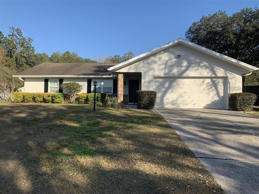 Fresh exterior/interior paint welcome you to this beautifully maintained Florida home tucked away in quiet neighborhood. This property is ideal for full-time living, seasonal enjoyment or investment. Offering comfortable living spaces in a functional layout, the home features natural light and neutral colors and well-proportioned rooms. Enjoy the peaceful outdoor setting with a detached 2 car garage, screened in patio, fenced backyard, pergola deck with custom fire pit, water feature and professional landscaping. Plenty of room to relax or entertain. New roof 2018, new A/C 2024. Conveniently located near shopping, dining, medical facilities, parks, renowned lakes, and nature trails. No HOA and easy access to major roadways make this a fantastic opportunity to own a slice of Florida living. Schedule your private showing today!