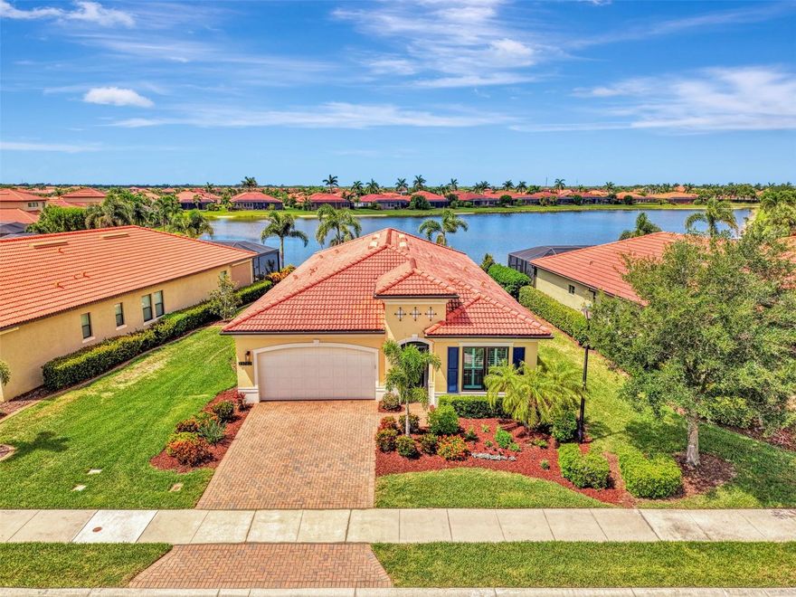 Own this stunningly renovated WCI built Key Largo model located in the highly sought after gated community of Sarasota National. One of the most desirable floor plans, the Key Largo features 3 en suite bedrooms, a 4th bedroom that easily works as an office/den, and an open concept floor plan designed for entertaining. Two deeded golf memberships included. Enjoy a tropical oasis with Southwest facing water views, a sparkling pool with new heater (2024), screen enclosure with clear view screens on all sides, decorative tile lanai walls, and a custom installed outdoor kitchen with vented hood and refrigerator (2024). The owners spent the last 4 years completely renovating this home, including brand new hurricane impact windows (2024). Storm prep is a breeze with an automated hurricane shutter that secures the lanai at the push of a button. On the inside, builder tile was removed, and luxury vinyl plank flooring was installed throughout, making this home carpet free! Other upgrades include new crown moldings, fresh interior and exterior paint, a new front door, designer light fixtures and fans, plantation shutters, and so much more! The kitchen cabinets feature dovetail constructed drawers and were recently professionally painted. The kitchen also features soft close doors and drawers, new champagne hardware, a luxury quartz countertop, large single bowl sink, upgraded fixtures, and new microwave (2026). The expansive living room has a decorative wood accent wall, tray ceiling, and a wall of sliders that leads to the lanai, and the light filled dining area easily accommodates guests. The primary suite has water views and a decorative accent wall, and the primary bathroom has dual sink vanity upgraded with quartzite counters, new fixtures, new LED mirrors, a walk-in shower, private water closet, and a large walk-in closet with custom built-ins. Two additional bedrooms are private suites with en suite bathrooms, both of which showcase new quartzite counters, and the 4th bedroom easily acts as a den/office with glass French doors. Just off the foyer you will find a butler’s pantry, a renovated half bathroom, additional closets, and an upgraded laundry room with utility sink and new washer and dryer (2026). New hot water heater (2024). The golf course is currently receiving a 5-star renovation, and this owner has already paid the renovation assessment in FULL. Sarasota National is a maintenance free community that includes irrigation, mowing, trimming, edging, fertilization, re-mulching, cable, guard gate, resort style amenities, championship golf course, and so much more! Live like you are on a 5-star vacation with a 30,000sf clubhouse with resort pool, hot tub, outdoor tiki bar serving food and drinks daily, coffee house, 3 dining options, 7,000sf fitness center with top-of-the-line equipment and classes, card room, bocce ball, pickle ball, tennis, dog park, playground, and event lawn! Sarasota National is a coveted 2400-acre International Audubon Bird Sanctuary that offers some of the most beautiful water and preserve views in all of Venice. This home is minutes from the new and exciting town center of Wellen Park and the Atlanta Brave's spring training camp at the CoolToday Park Stadium. Explore 3 local beaches and historic downtown Venice, all just a short drive from your front door! If you have dreamed of owning a piece of Florida's paradise, look no further than Sarasota National... one of Venice's premiere golf communities!