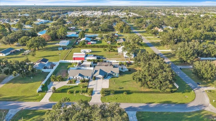 Welcome to an incredible property offering endless opportunities for living, investing, or both — all set on over an acre of land. This unique estate features three separate dwellings, including a stunning primary 3-bedroom, 2-bathroom home with a private pool, a second 3-bedroom, 2-bathroom home that has been a successful short-term rental, and a third detached dwelling originally built as a shed but thoughtfully converted into a fully equipped living or office space with a bedroom, kitchenette, and full bathroom.
Designed by a custom home designer, every inch of this property showcases meticulous craftsmanship and attention to detail. Inside the main home, you’ll find granite countertops, stainless steel appliances, and custom-built closets, all wrapped in a clean, modern aesthetic that blends style with comfort. The open-concept layout and natural light make the space perfect for everyday living or entertaining guests.
The second home mirrors the same quality finishes, offering flexibility for income potential or extended family living. The third unit’s versatility adds even more value — ideal for a home office, guest suite, or creative studio.
Outside, the property’s expansive acre-sized lot provides plenty of room for outdoor activities, gatherings, and future possibilities. Enjoy afternoons by the pool or evenings under the stars in a peaceful setting that still keeps you close to everything.
Located just minutes from I-75, this property offers easy access to shopping, dining, and a rapidly growing community filled with new developments and amenities. Whether you’re looking for a multi-generational retreat, an investment property with multiple income streams, or a private compound to call home, this one-of-a-kind estate delivers it all.
Opportunities like this are truly rare — a modern, well-designed property with this much flexibility and land in such a convenient location is truly a special find. Give me a call and schedule a showing today and see for yourself!