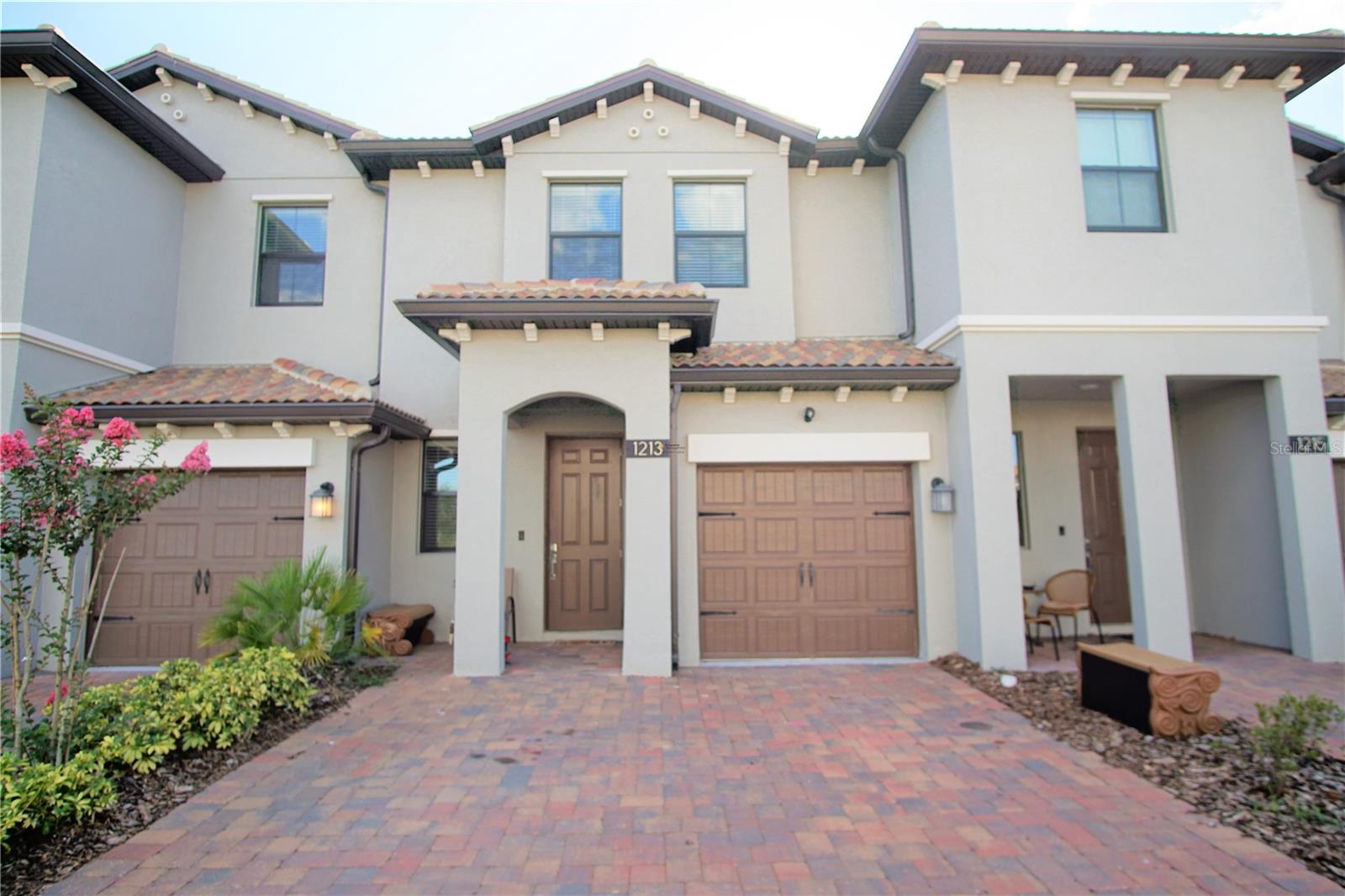 This extraordinary luxurious two-story townhouse features three spacious bedrooms, plus two and one-half bathrooms. The covered entry leads into an elegant dining room which connects to a spacious great room that overlooks the kitchen. The kitchen has newly renovated cabinets, granite countertops, all tile on the first floor, and a large living room space to entertain. There is an appealing lanai perfect for relaxing and enjoying the scenic community golf course. All the bedrooms are on the second floor with two large-sized bathrooms. The master bedroom has a private bathroom with a large walk-in closet and views of the beautiful golf course. Downtown Champions Gate also offers premier restaurants and upscale shopping close to the Vistas. Also near your local supermarkets such as Publix and Walmart and conveniently located just minutes away from Walt Disney World, the Omni Hotel and Resort, International Drive, and I-4, where you and your family can eat and shop all within minutes from their doorstep. The community also offers a large pool, hot tub, covered pavilion, community room, serving kitchen, game room, golf simulator, fitness center, sauna, and a walking trail along the golf course. Golf carts are also available for rent at a discounted price. This home allows pets.