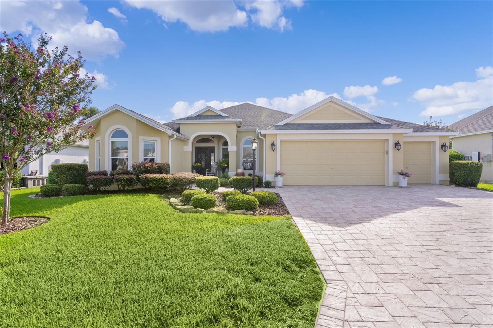 Welcome to this stunning expanded Gardenia model in the highly sought-after Village of
Fenney! From the moment you arrive, you’ll be captivated by the beautiful water feature that
sets the tone for the elegance and serenity this home offers.
Inside, the open layout has been thoughtfully designed without the standard Gardenia dining
room columns, creating a seamless, spacious flow throughout the main living areas. The home
features 3 bedrooms and 2 bathrooms, each bedroom offering a built-in closet for
convenience.
The gourmet kitchen is equipped with granite countertops, light contemporary cabinetry,
and a charming breakfast nook, while the home also boasts a formal dining room and formal
living room—ideal for both everyday living and entertaining.
The expansive enclosed, air-conditioned lanai is truly a highlight, overlooking a tranquil pond
view. With two oversized sections, it provides the perfect setting for entertaining guests or
enjoying peaceful Florida evenings.
The luxurious master suite offers a spa-like retreat with split vanities, his & hers walk-in
closets, and a roll-in walk-in shower, blending comfort and accessibility.
Additional features include:
*Vaulted and high ceilings with rounded corners for a refined finish
*Ceramic tile throughout living areas and cozy carpet in the bedrooms
*2-car garage PLUS golf cart garage with pull-down attic stairs
*Whole-house water purifier
This block stucco home combines high-end details with thoughtful functionality, all set in the
natural beauty and vibrant lifestyle of The Villages.