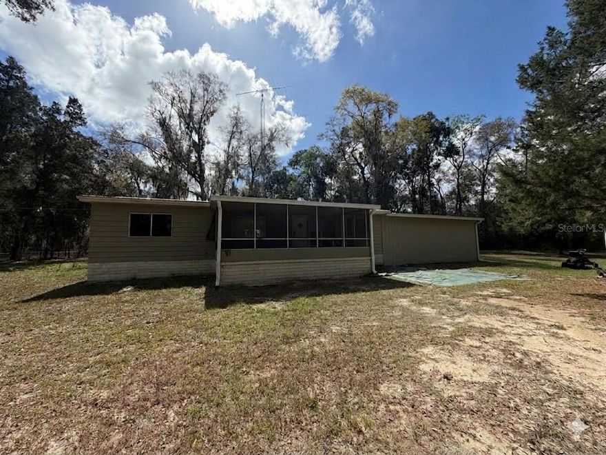 Experience rural freedom with this sprawling 2.51-acre agricultural property in Belleview. This comfortable 3-bedroom, 2-bathroom double-wide features significant mechanical updates including a two-year-old central HVAC system, a newer well pump, and a recently replaced septic drain field. Relax in your screen-enclosed porch overlooking a private, wooded landscape with no HOA restrictions. Publix is only 4.5 miles away. It is only a moderate drive to the dining and shopping of The Villages and Downtown Ocala. This property is close to the outdoor adventures of the Ocala National Forest and the world-class equestrian facilities of the Florida Horse Park and World Equestrian Center. This property offers the perfect canvas for your country lifestyle.