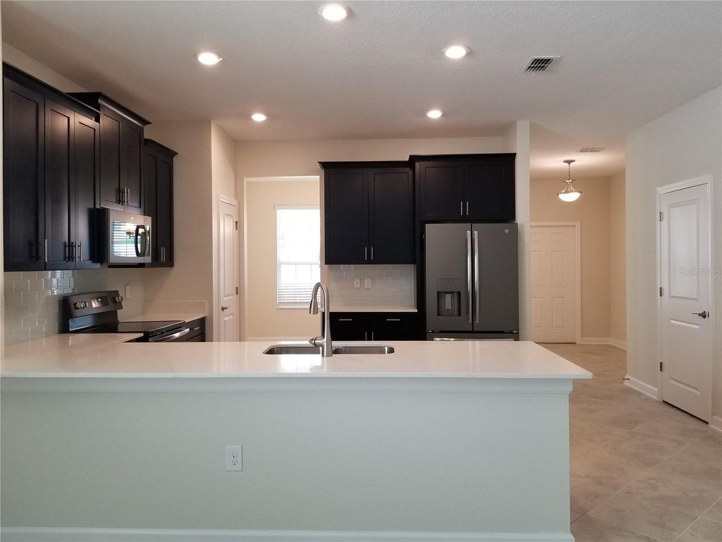 Photo of 11142 Longleaf Woods Drive, Orlando, FL 32832 (MLS # O6409949)