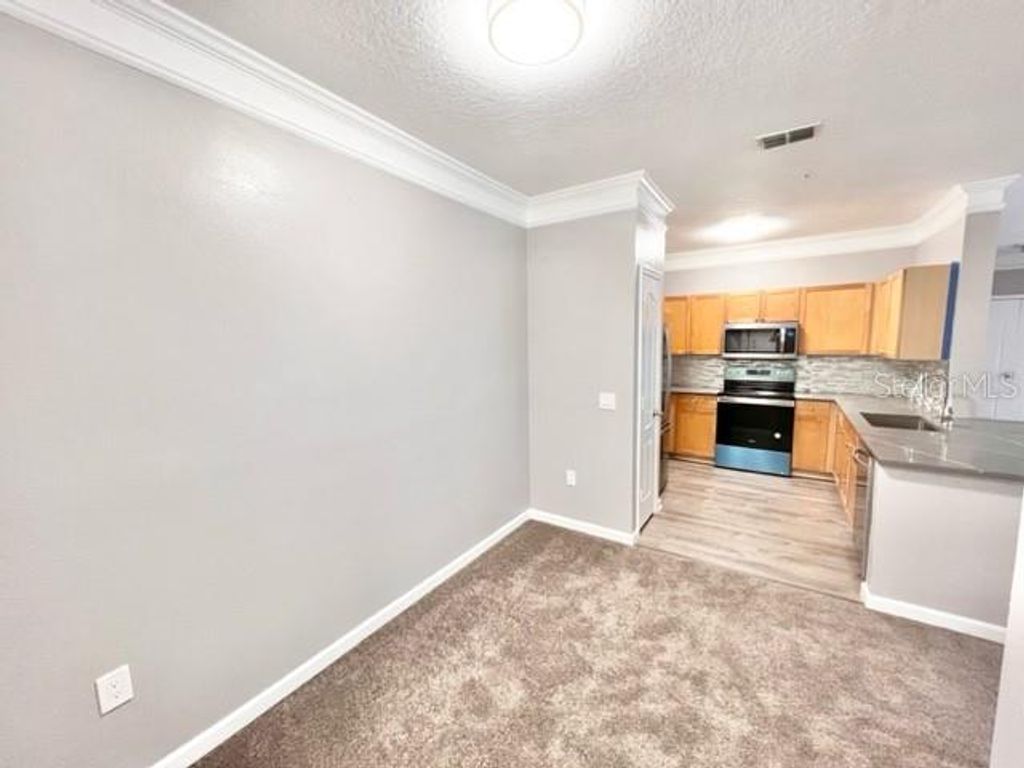 Photo of 8836 Villa View Circle #306, Orlando, FL 32821 (MLS # O6372419)